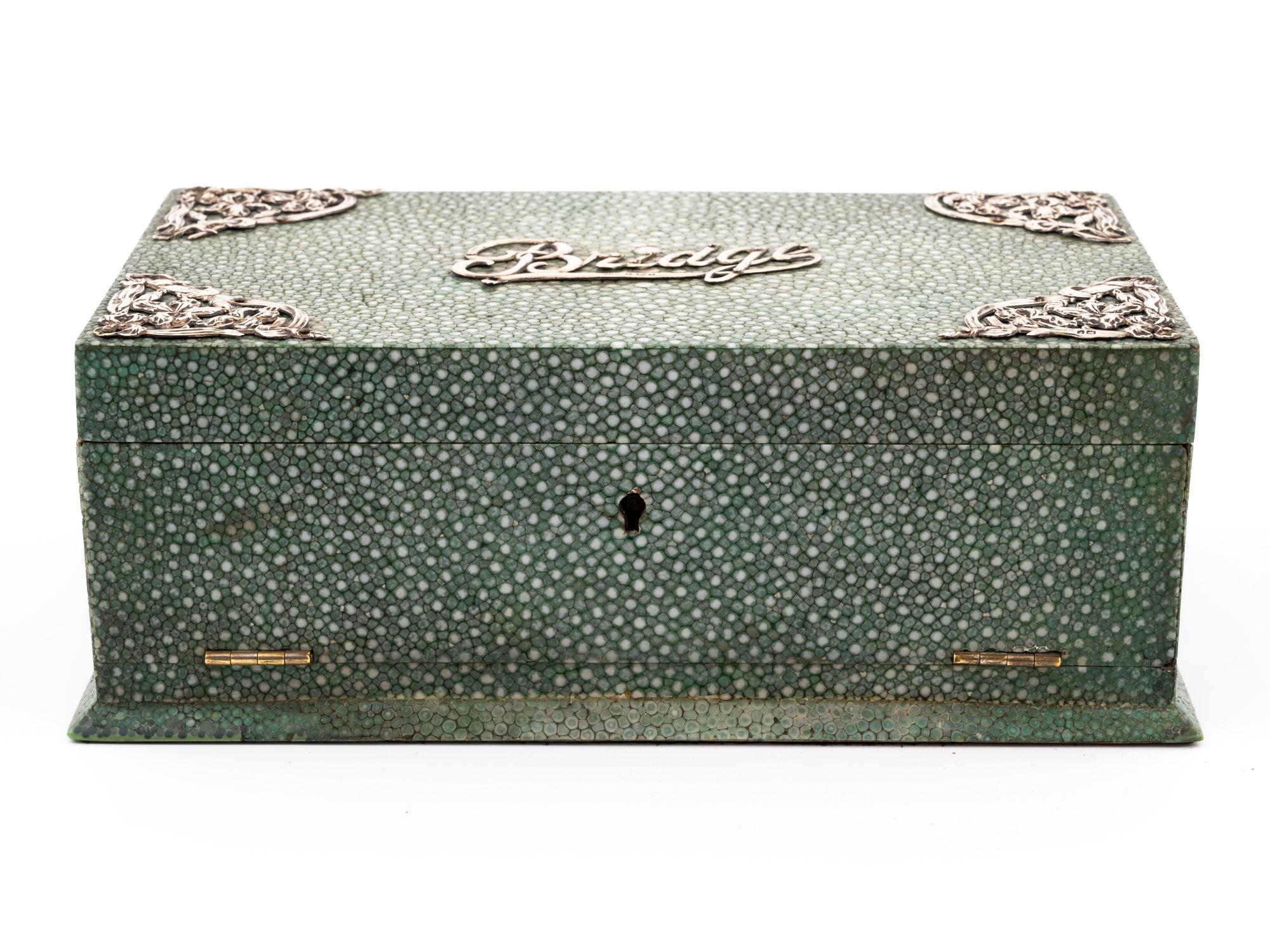 With Bridge Game Contents 

From our Boxes collection, we are delighted to offer this Green Stained Shareen Bridge Games Box. The box of rectangular shape seated upon a plinth base with a fully covered exterior in Green stained Shagreen. The Box