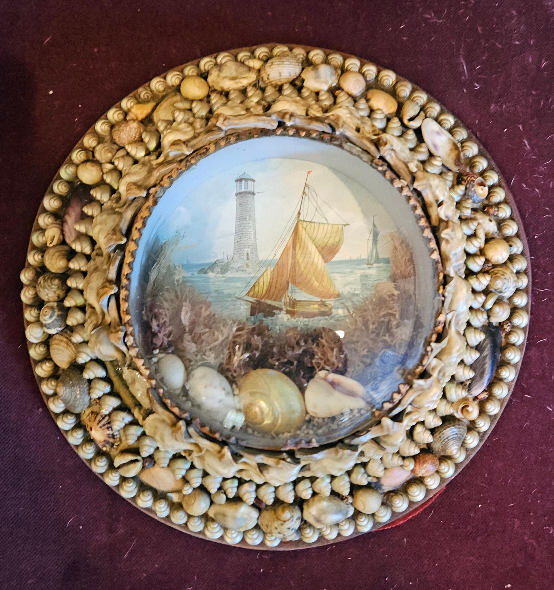 Edwardian Shellwork Valentine Diorama of a Sloop with Lighthouse
Date: Circa 1900
Origin: England

Materials: Shells, coral, seaweed, chromolithograph, wood, glass

Dimensions: 8 inches diameter x 2 inches deep  (27 cm x 5.08cm) 


A finely executed