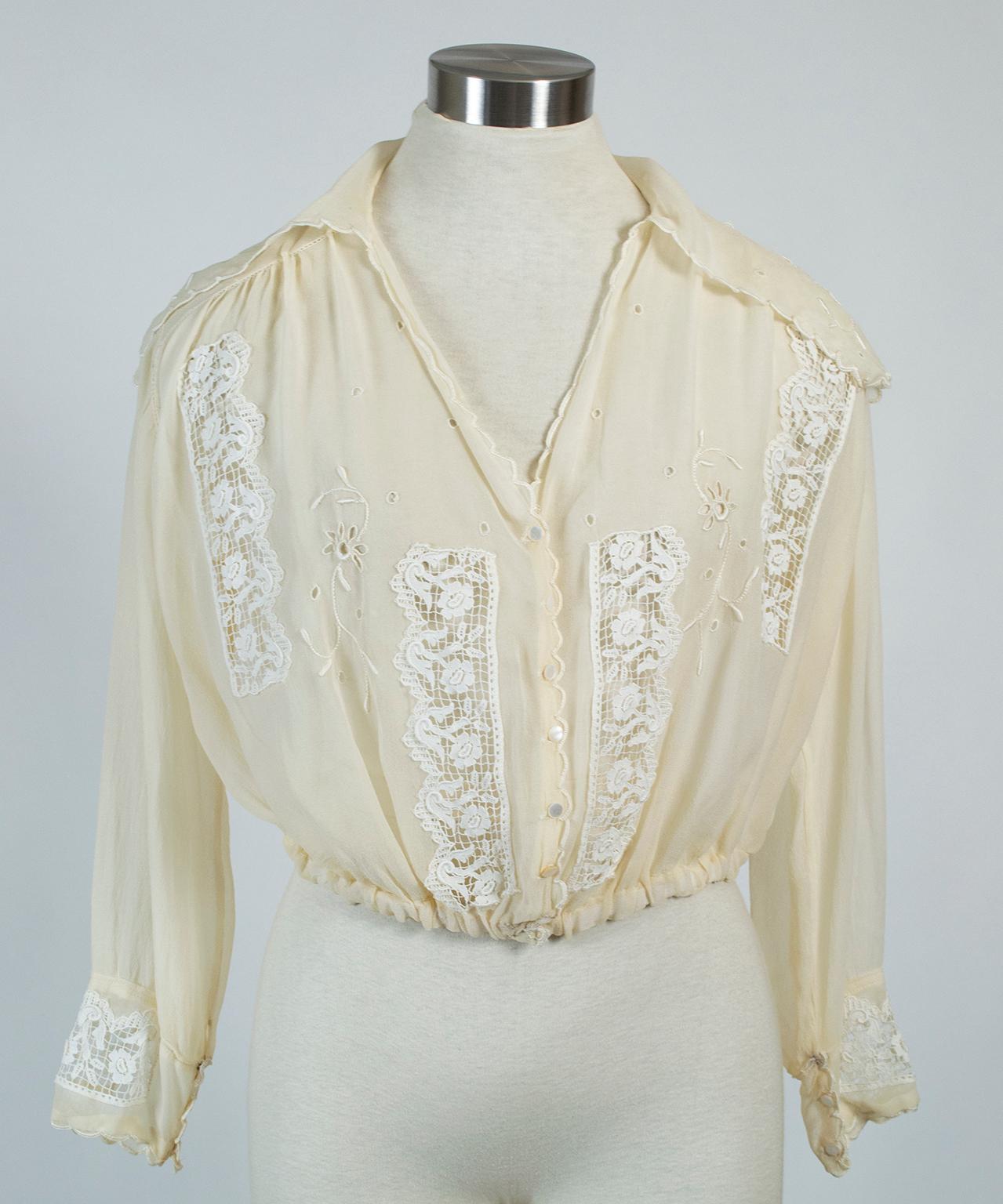The best of both worlds, this century-old blouse combines ultra-feminine edge scallops, lace insets and a dramatic neckline plunge with an androgynous rear bib to create a unique garment that can be dressed up or down. We love the contrast of the