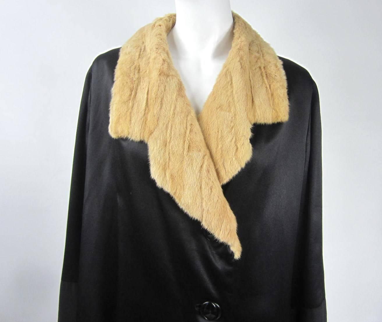 This is fabulous! Black silk with beige lining. Take a look at the buckle on the back of this coat. Ermine Fur on collar and cuffs---Measuring Up to 44 Bust--Up to 46  Waist -- Up to 46 Hips-- Length 43--Sleeve 23.5--Cuff fur 2.5.  Be sure to check