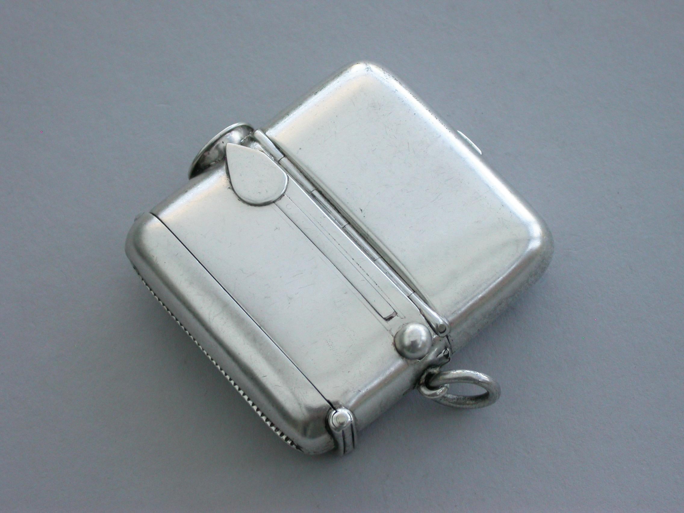 A good quality Edwardian large silver combination Vesta case/double Sovereign case/Cheroot cutter, of rounded rectangular form with attached suspension ring and flip top lid to the vesta, a sprung hinged lid to the sovereign case with compartments