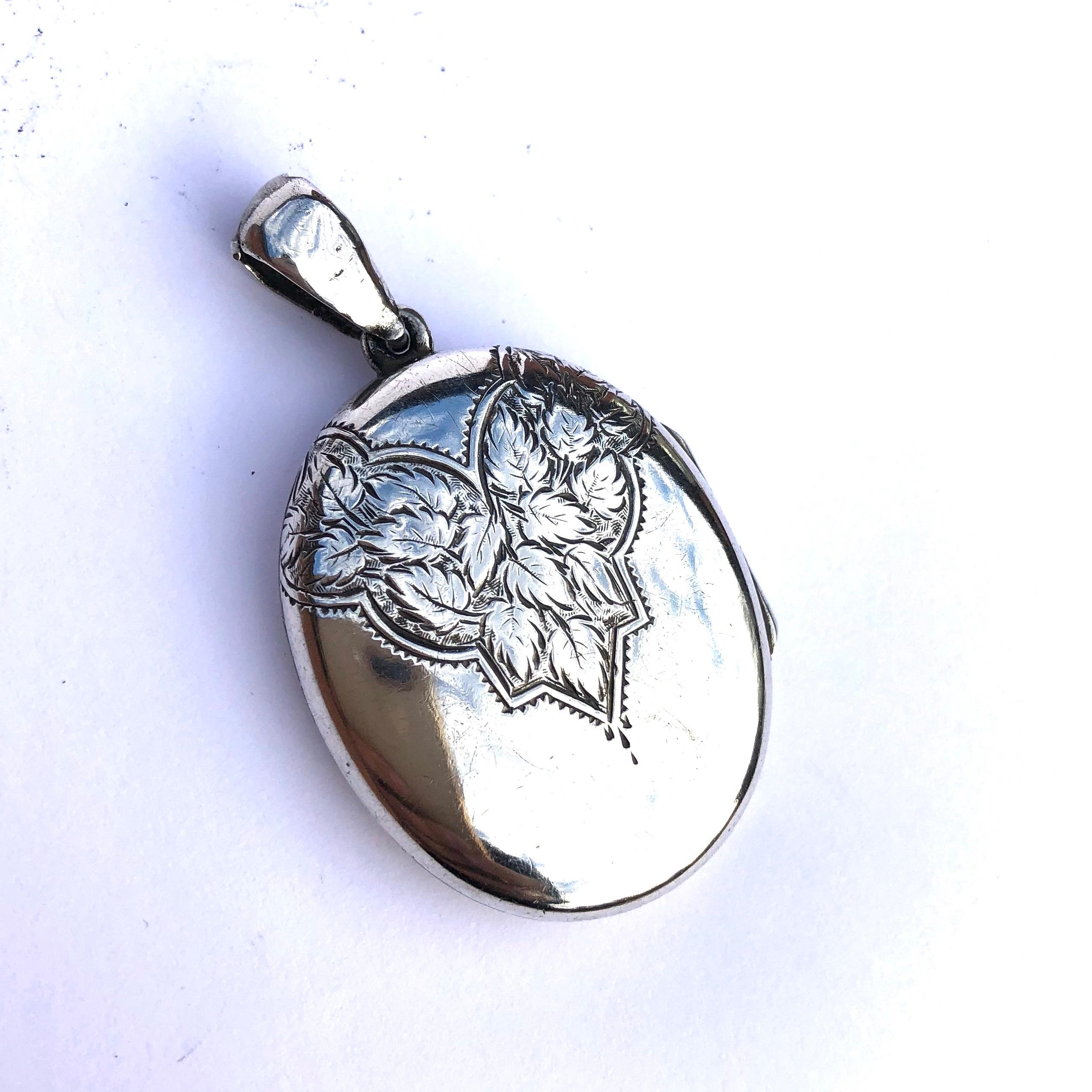 The initials engraved on the front of this locket are etched in an extravagant manner, the four letters read WCEG. Im not sure of the order, maybe you could make the your own! On the back of the locket there is also leaf detail. When you open the