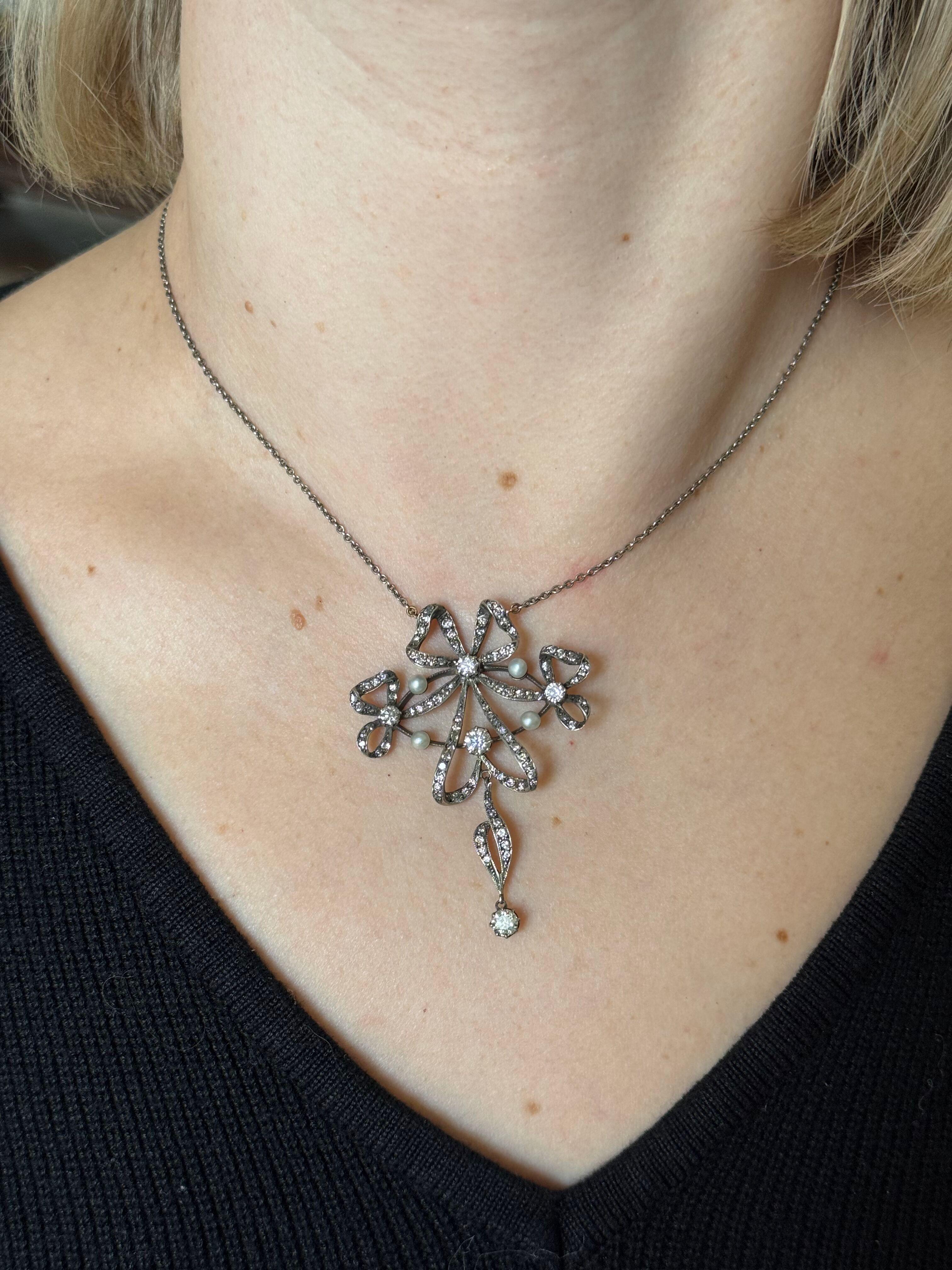 Antique Edwardian silver and gold accent necklace, featuring 3.3mm pearls and diamonds ( total approx. 0.95ctw). Necklace is 16