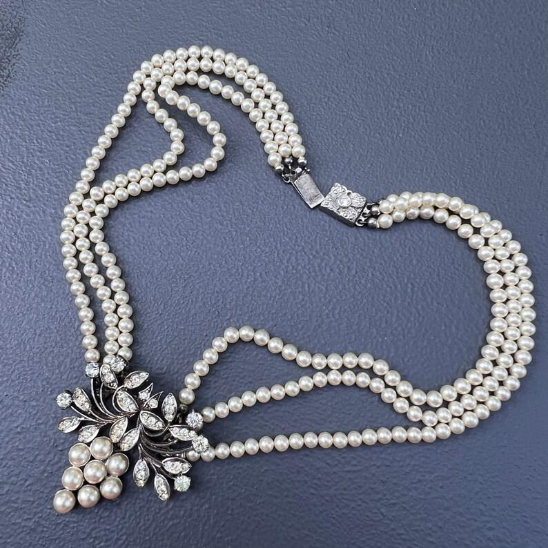 Embrace the allure of Edwardian elegance with our Antique European Silver Paste Grape Cluster Choker Necklace. Crafted from 835 silver, this exquisite piece features a cluster of sparkling paste stones and faux pearls arranged in the likeness of