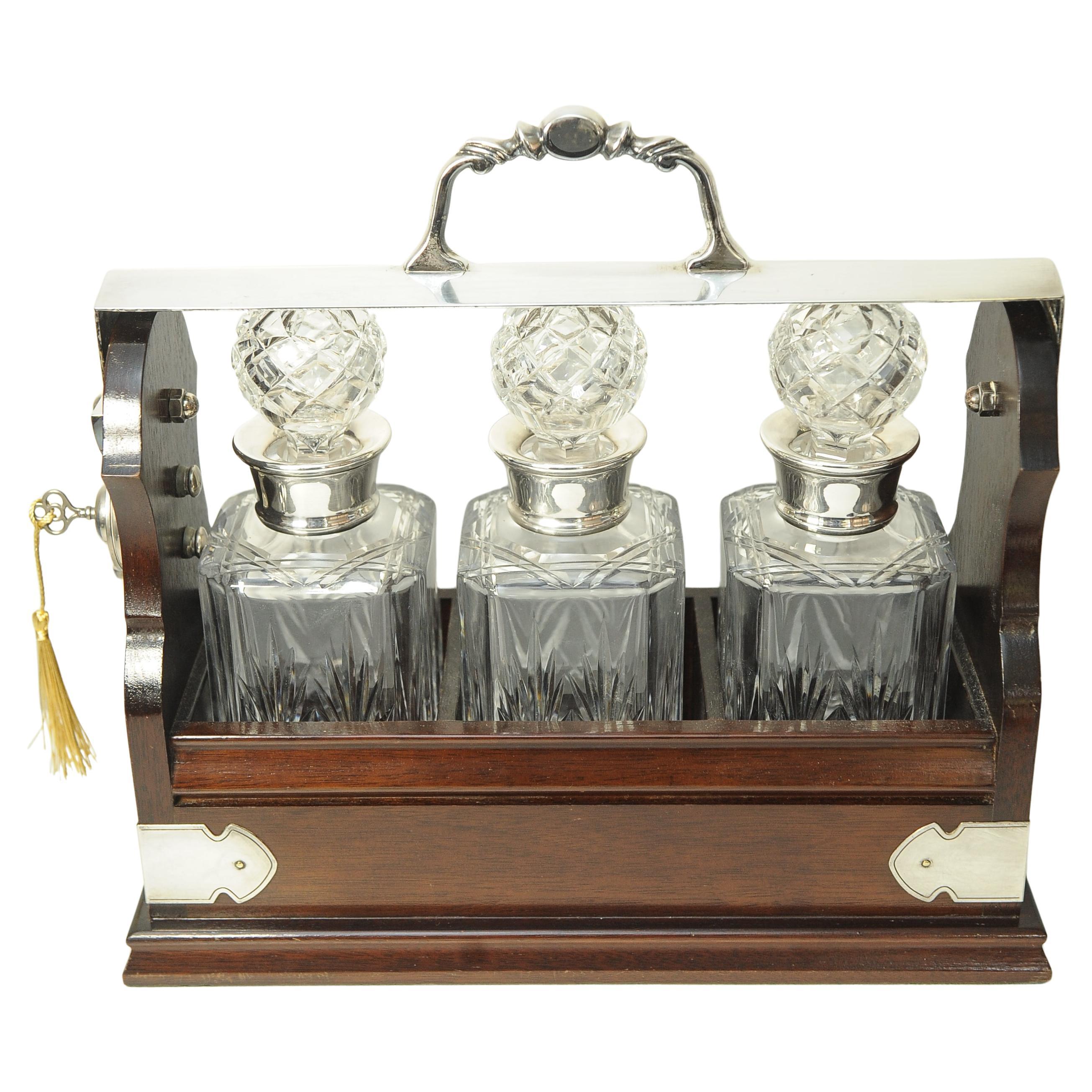 Edwardian Tantalus With A Set of Three Square Cut Glass Decanters In Good Condition For Sale In Reading, Berkshire