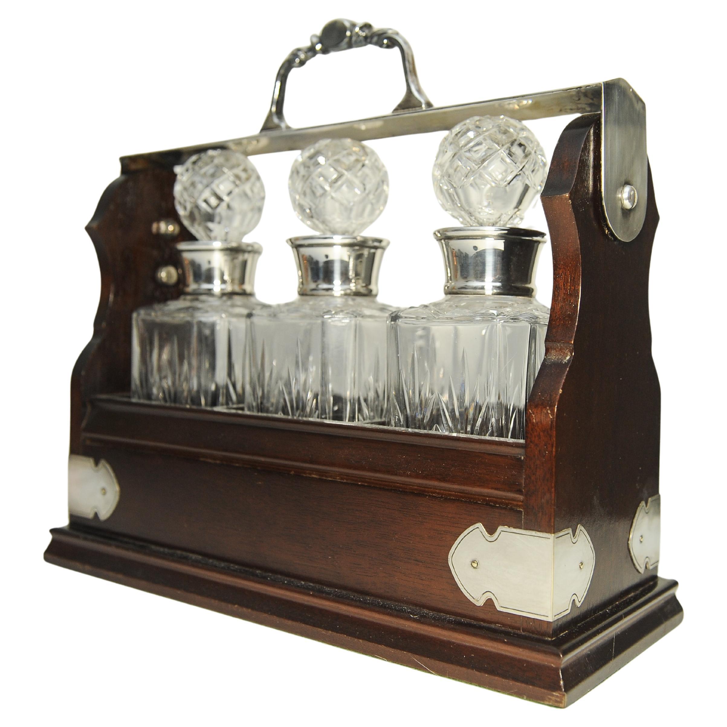 Edwardian Tantalus With A Set of Three Square Cut Glass Decanters For Sale 1