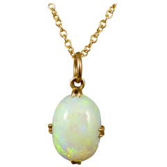 Edwardian Single Oval Opal Pendant in 18 Carat Gold on 9 Carat Yellow Gold Chain