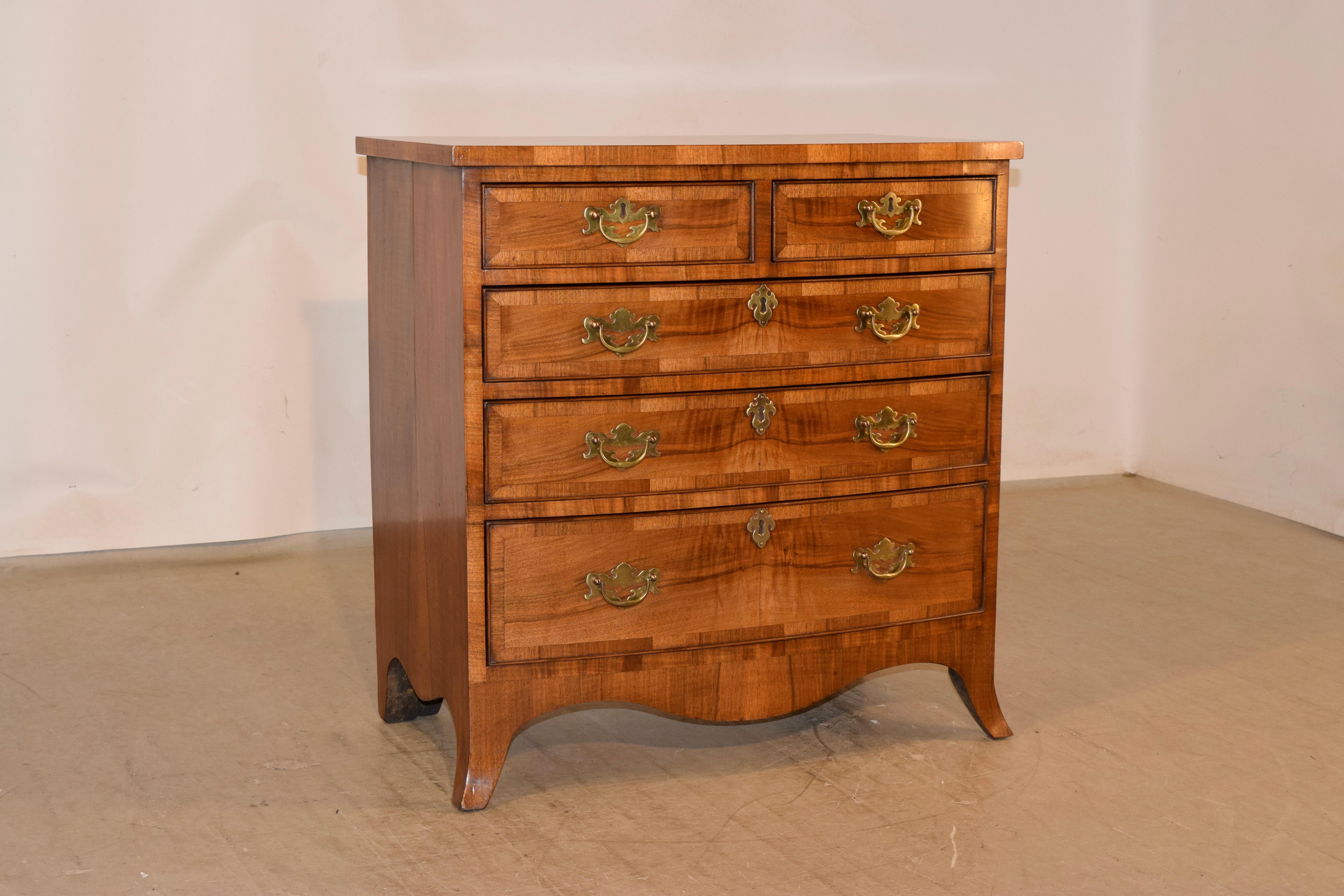 Fantastic Edwardian small chest of drawers from England made from rosewood and walnut. The top is book matched rosewood, banded with a wonderfully grained rosewood border. The sides are also made from book matched rosewood for added detail to this