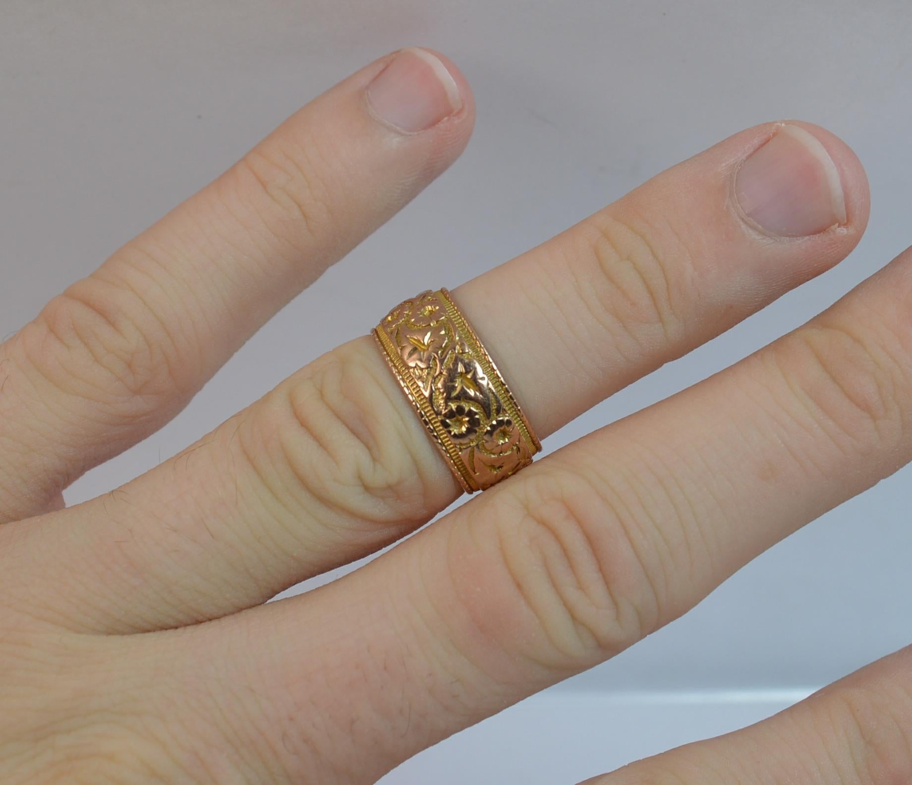 
A true solid 9 carat rose gold stack band ring.

A large 8mm wide band throughout with an ivy leaf design throughout.

Size K UK, 5 1/4 US. 4.4 Grams. Excellent condition. Crisp pattern and crisp hallmarks.