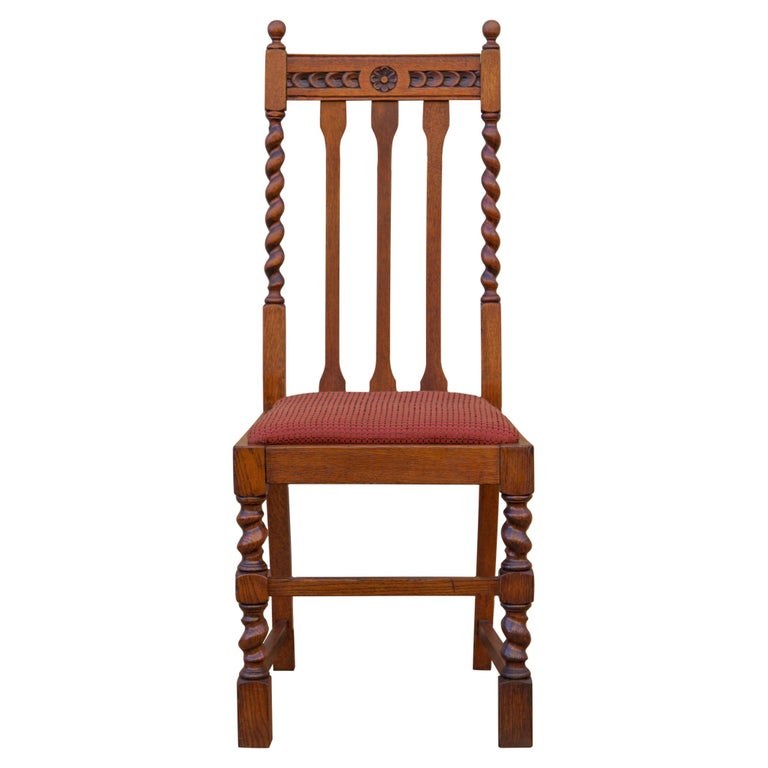 Shipping. Maker not on list.

Antique solid oak high back Edwardian barley twist side chair or dining chair by John M Smyth & Co, c 1910. Attractive oak grain with rich dark honey color. Beautiful hand-carved detail on crest rail with barley twist