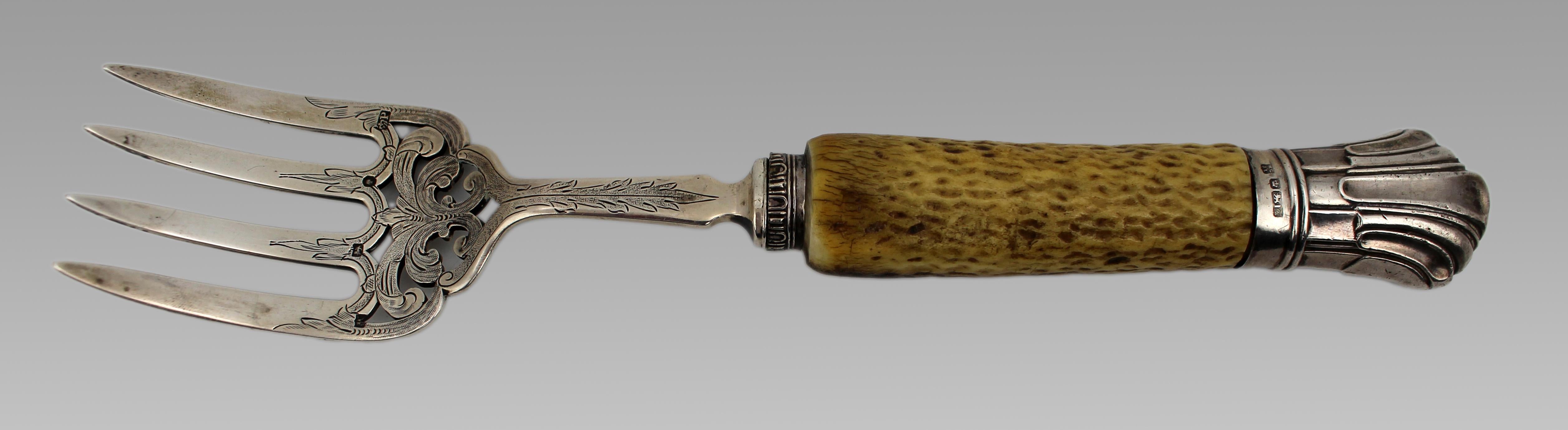 Edwardian Solid Silver and Bone Handled Bread Fork, Sheffield, 1907

A fine Edwardian silver bread fork with four engraved prongs and a naturally textured bone handle. The later solid silver fluted ferrule complements the design.

Fully hallmarked: