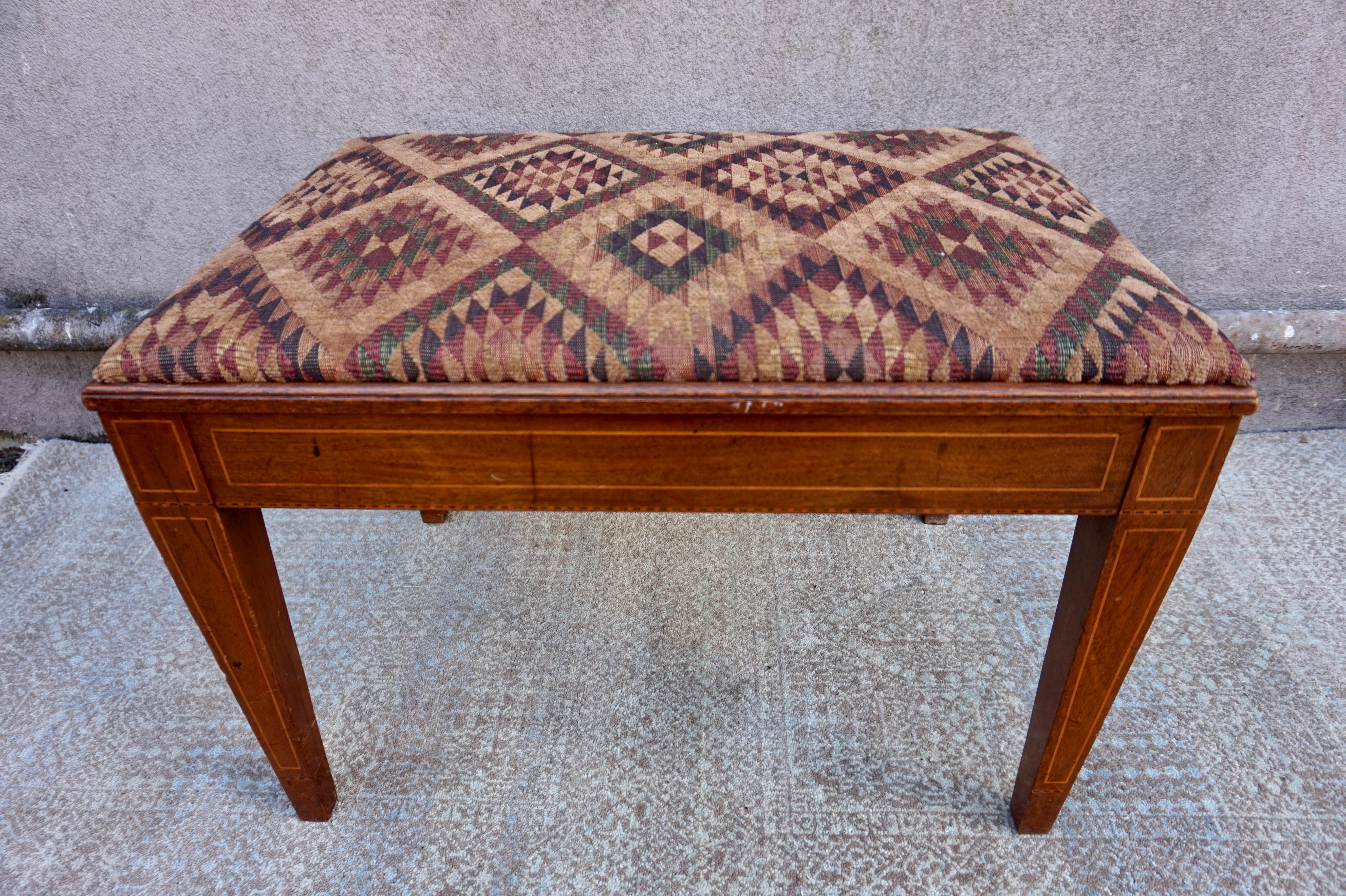 Rare Edwardian Bench with tapering legs and Satinwood inlay. Constructed from solid wood and in good used condition. The chenille fabric has been replaced and the seat dismantles. Ideal for foyer or tight spaces. Sturdy.