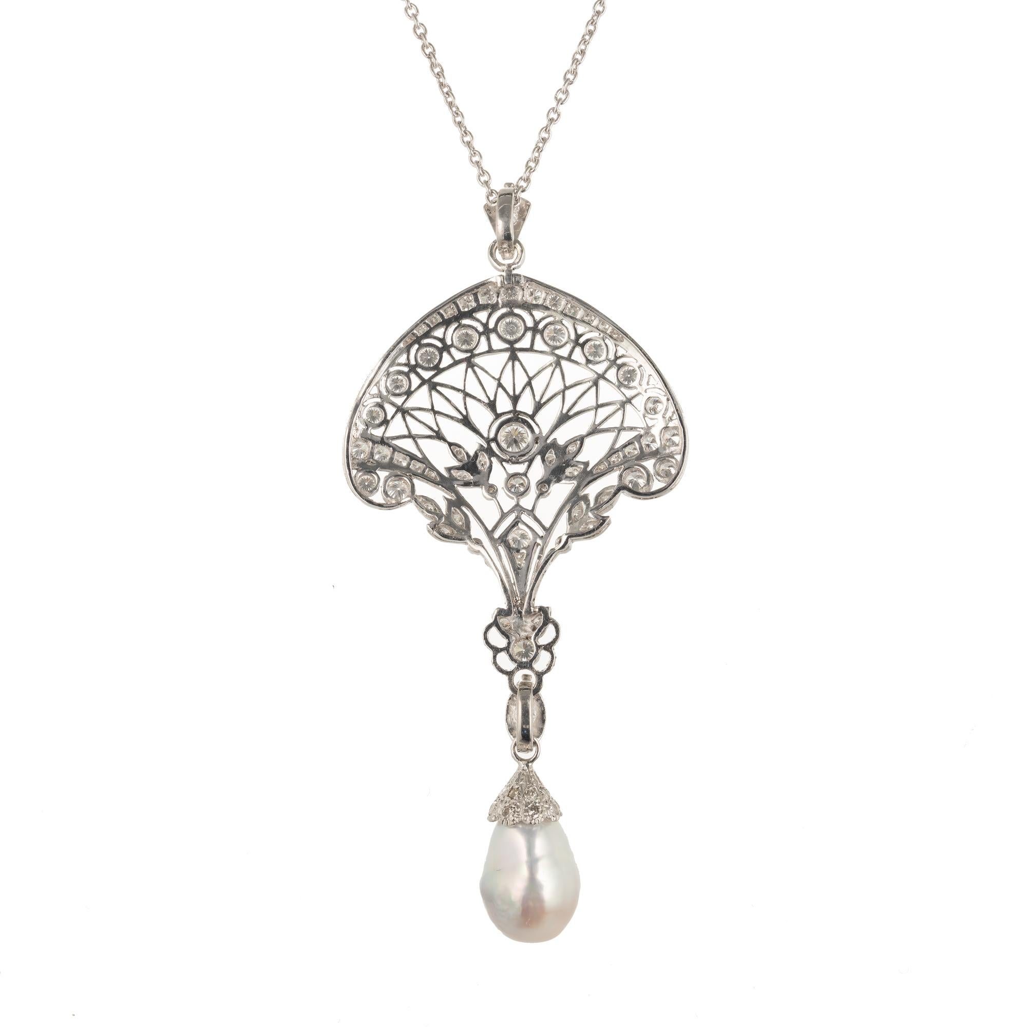 Edwardian Pearl and diamond open work pendant necklace. Platinum filigree pave set diamonds. Iridescent silvery South Sea semi-precious baroque pearl with rolling tints of both greenish blue and pink. The bail on the pearl opens. It can be removed