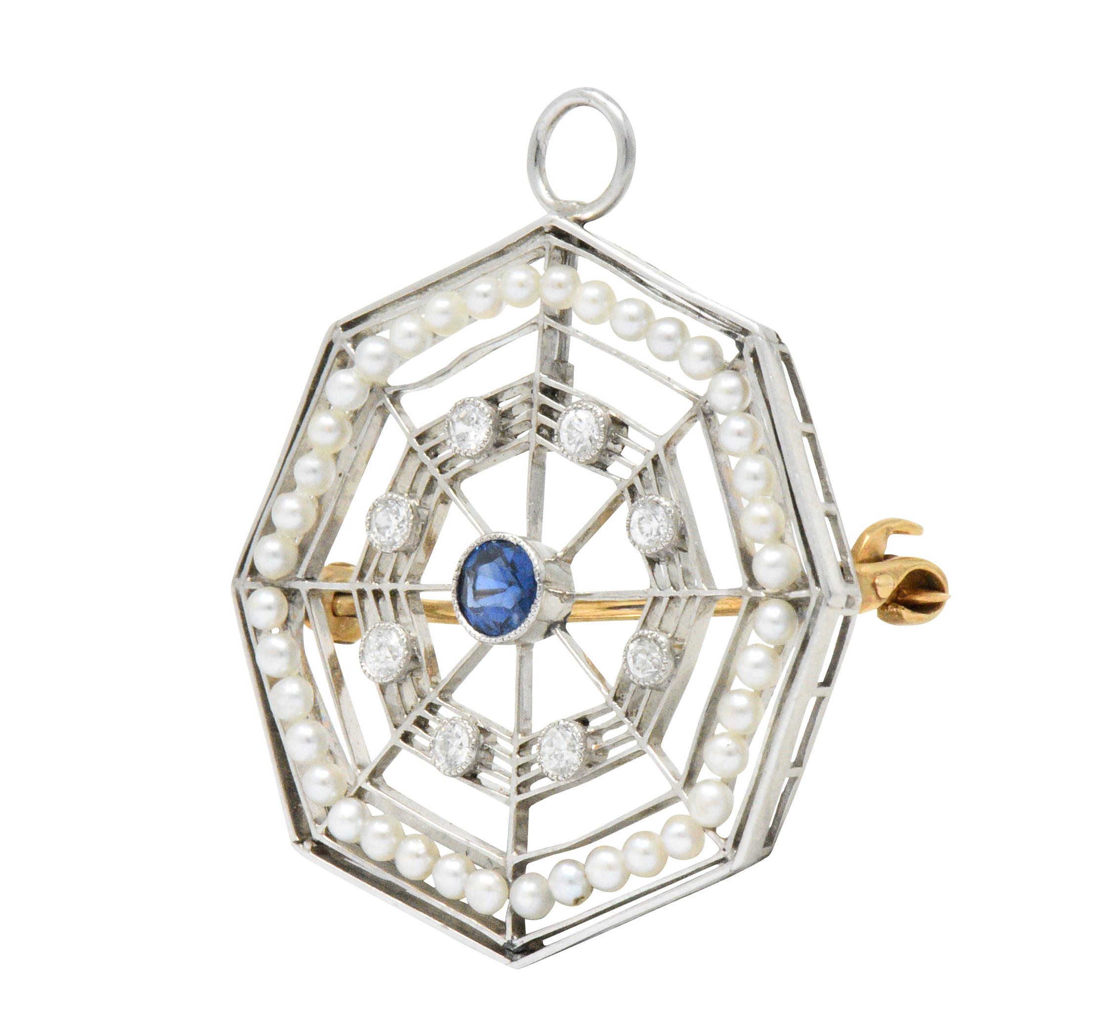 Spider web motif centering a round cut sapphire weighing approximately 0.15 carat, bright blue

Accented with 8 old European cut diamonds, weighing approximately 0.16 carat total, eye-clean and white

Intricate webbing and seed pearl detail

Late