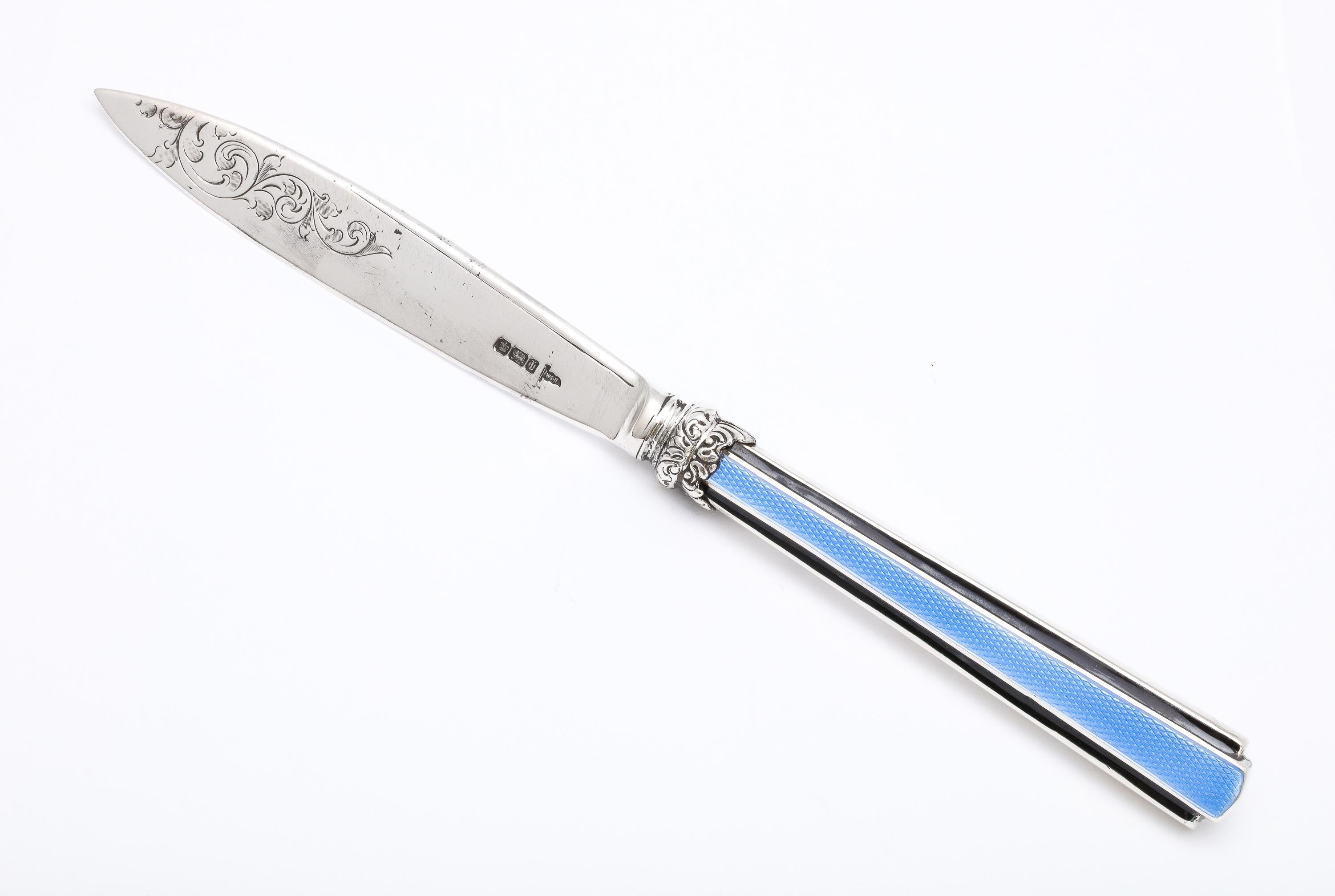Edwardian, sterling silver and blue and black guilloche enamel-mounted letter opener/paper knife, Sheffield, England, year hallmarked for 1903, Walker and Hall - makers. Sterling silver blade is etched. Measures 9 inches long x 3.4 inches wide (at