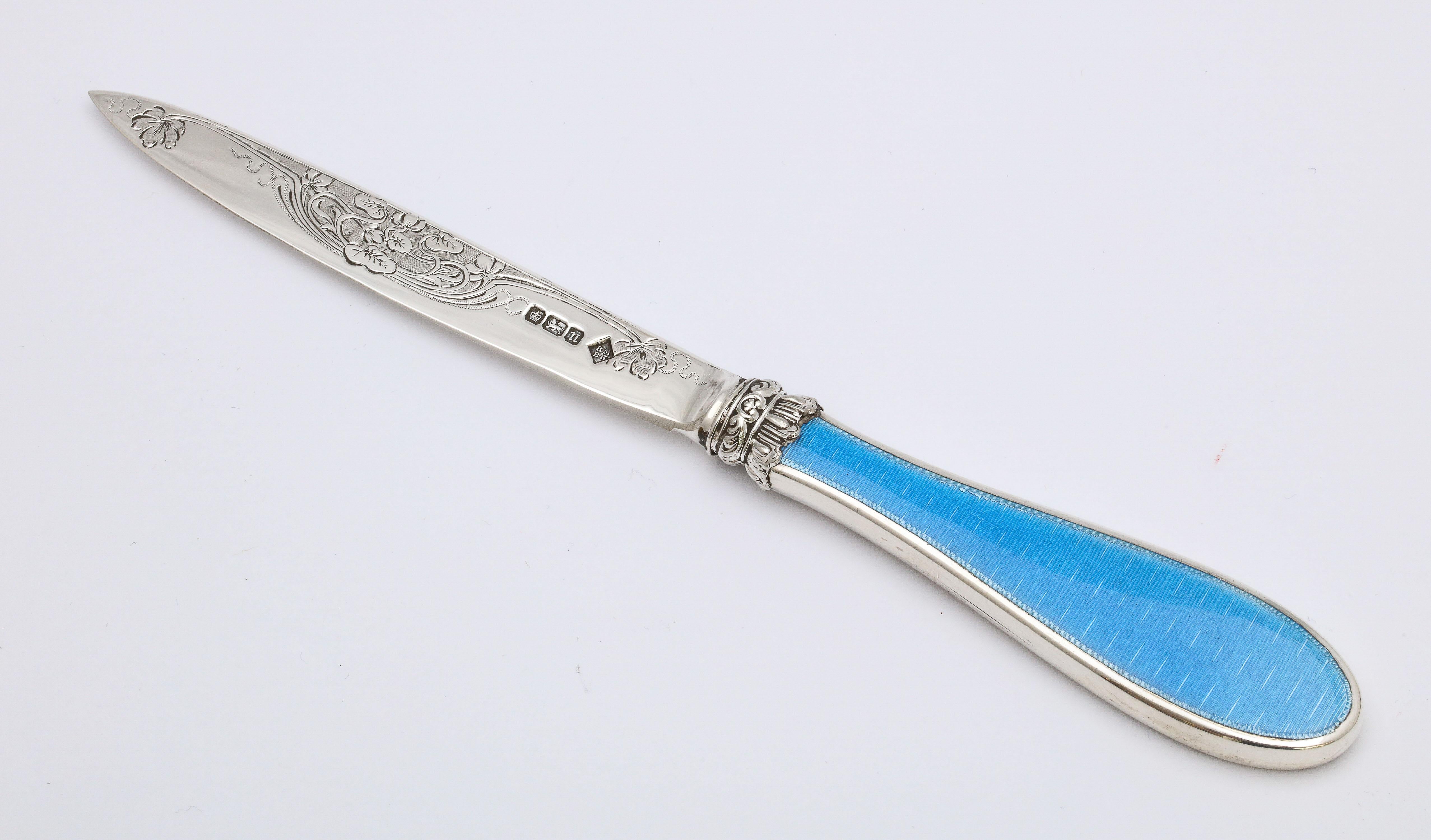 Edwardian, sterling silver letter opener/paper knife with blue guilloche enamel handle, Sheffield, England, 1905, Martin and Hall - Makers. Measures 8 inches long x 1 inch deep (at deepest point) x 1/2 inch high (at highest point) when lying flat.