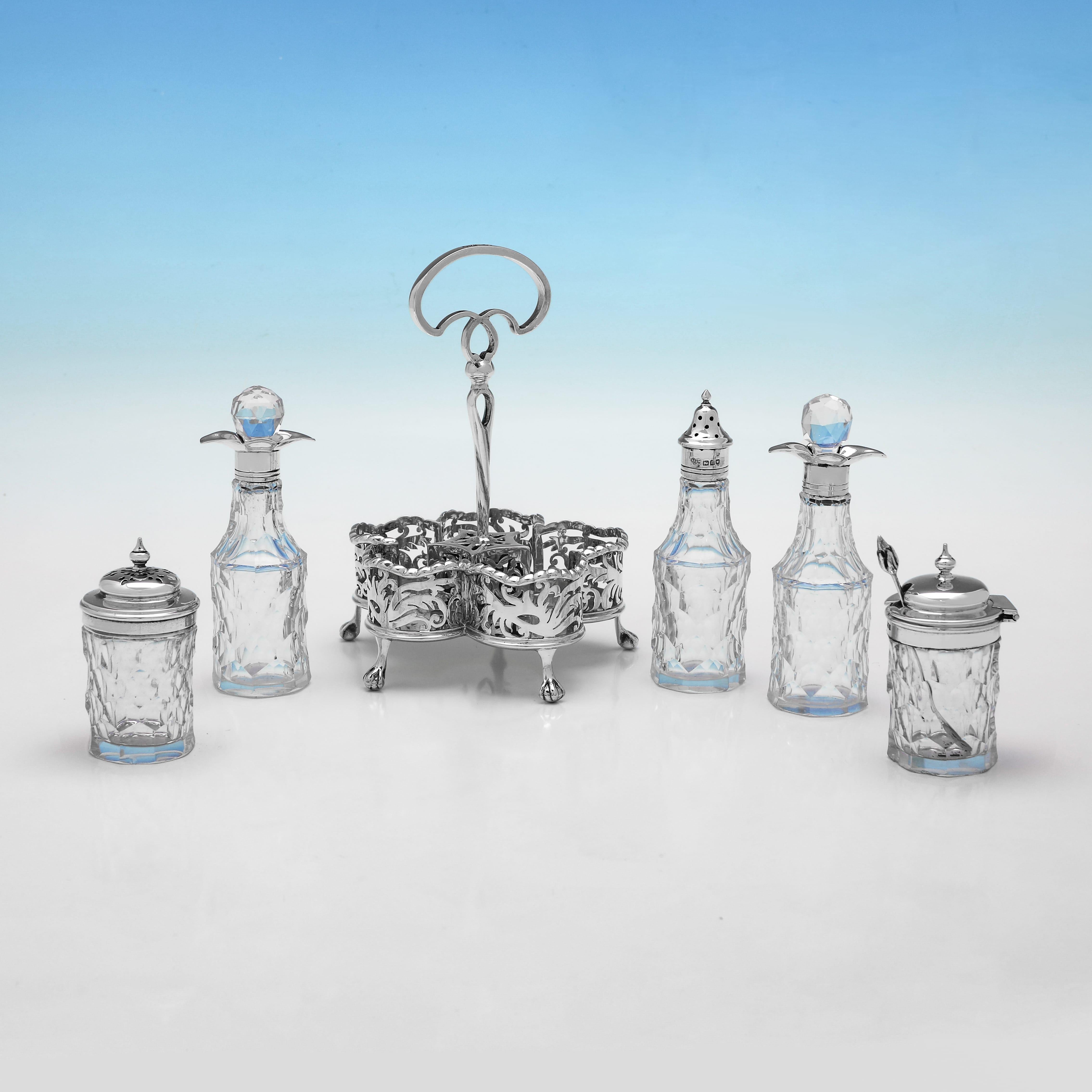 English Edwardian sterling silver and glass cruet set by Goldsmiths & Silversmiths 1908 For Sale