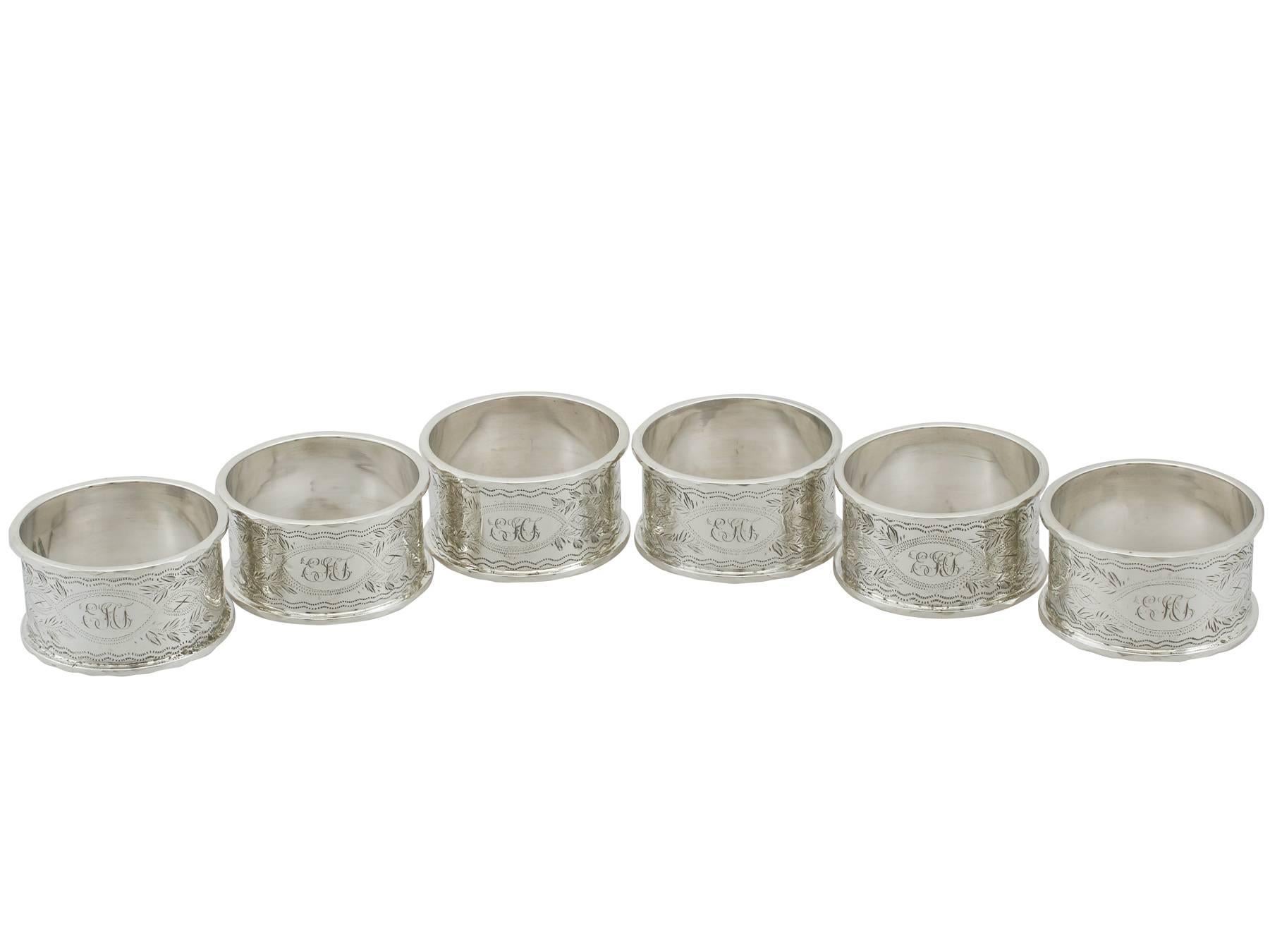 An exceptional, fine and impressive set of six antique Edwardian English sterling silver napkin rings - boxed by Walker & Hall; an addition to our dining silverware collection.

This exceptional set of antique English sterling silver napkin rings