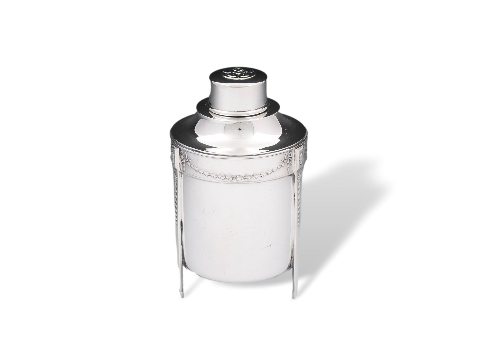 From our Tea Caddy collection, we are pleased to offer this Edwardian Sterling Silver Tea Caddy. The Tea Caddy of cylindrical shape with a slightly tapered body stood upon three straight legs. The Tea Caddy beautifully cast with swags of bellflowers
