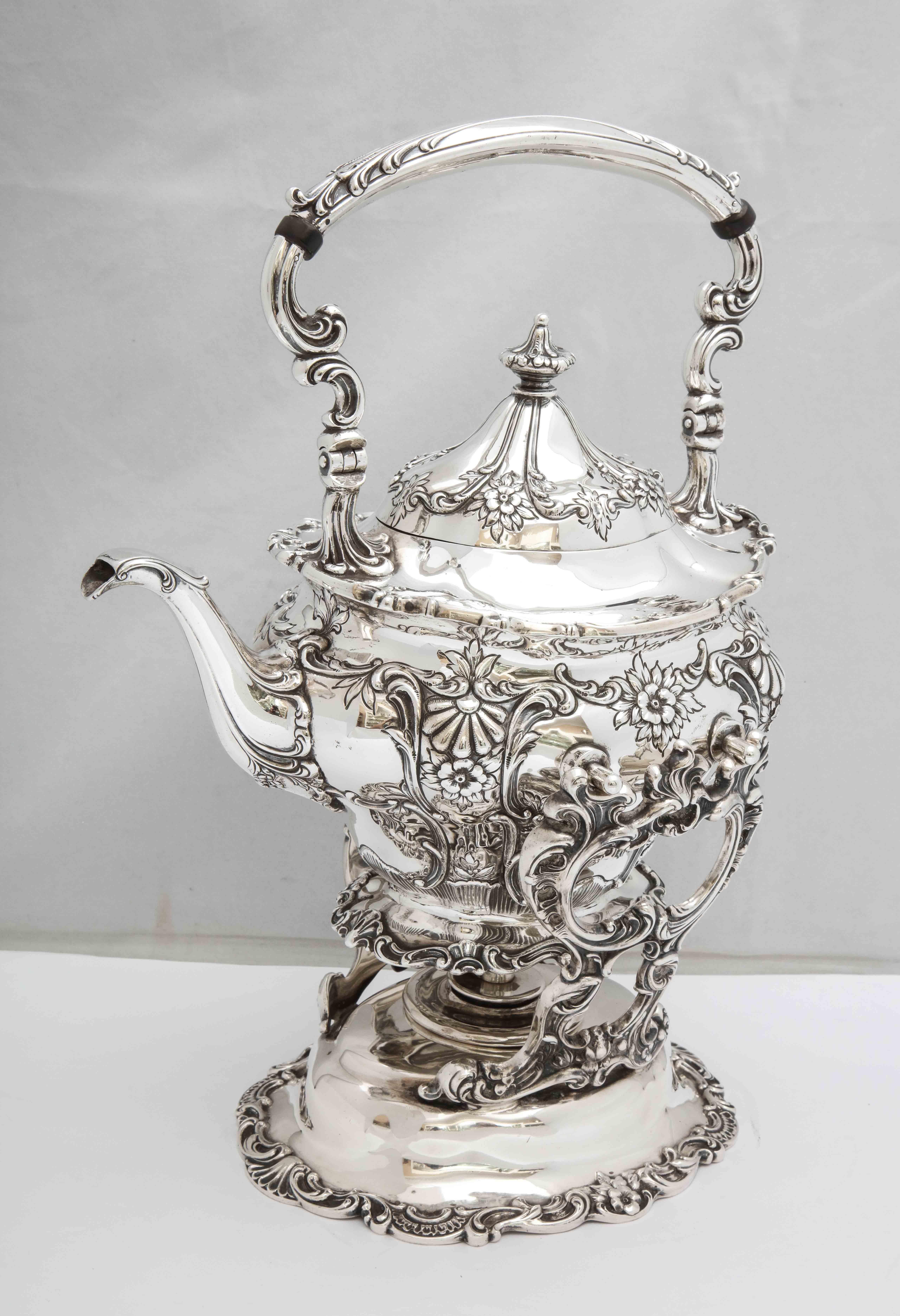 Victorian-Style, sterling silver tea kettle on stand with original, working, sterling silver burner, Gorham Mfg. Co., Providence, Rhode Island, year hallmarked for 1903. Beautiful floral design. Measures 14 1/2 inches high to top of handle x 10