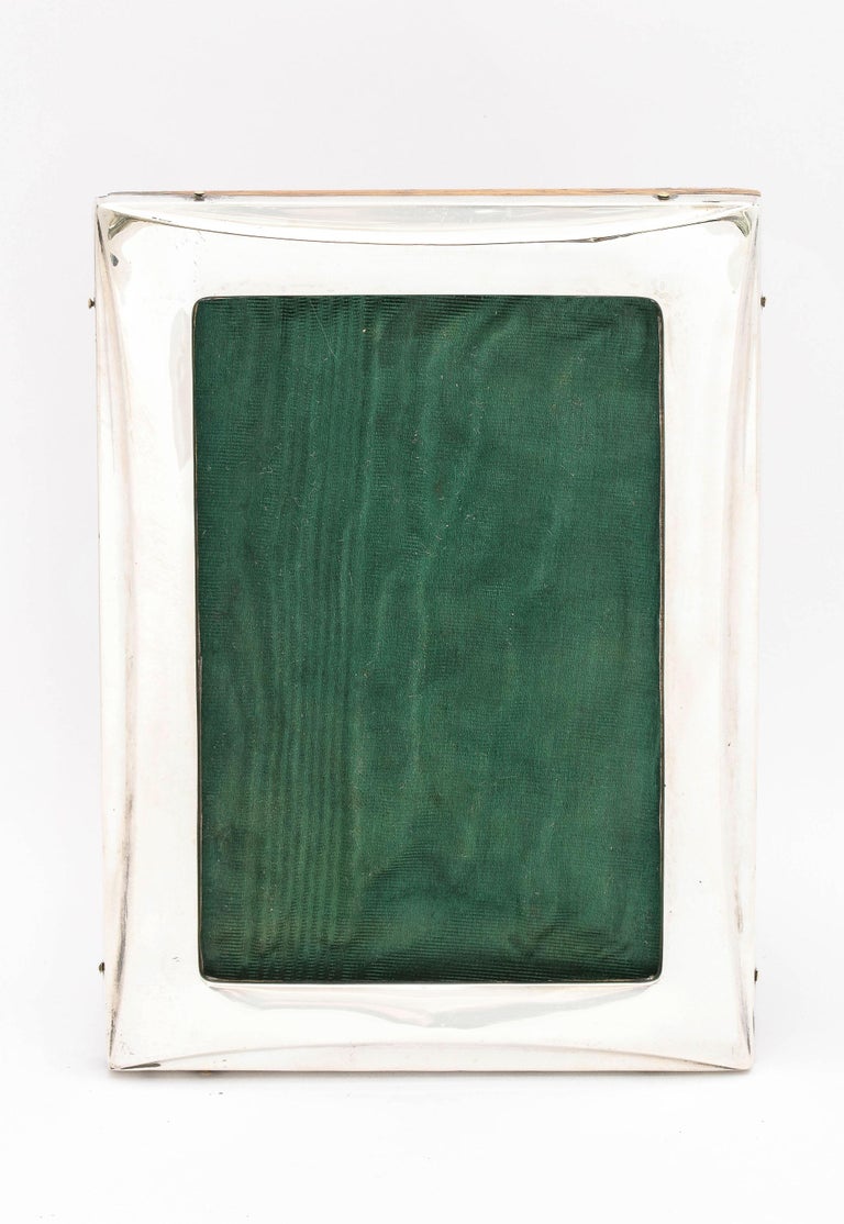 Edwardian, sterling silver wood-backed picture frame, Birmingham, England, year-hallmarked for 1913, Cooper, Pegler and Co. - makers. Frame will stand both horizontally and vertically. Measures almost 6 3/4 inches high x 5 inches wide x 5 1/2 inches