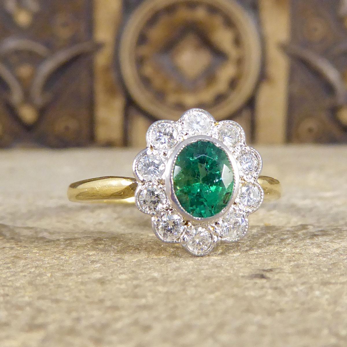 This gorgeous ring holds a mesmerising Oval Cut Emerald weighing 0.60ct with normal Emerald inclusions, surrounded by 0.35ct of brilliant cut Diamonds adding sparkle to an already glistening piece. All the stones are set in an 18ct White Gold rub
