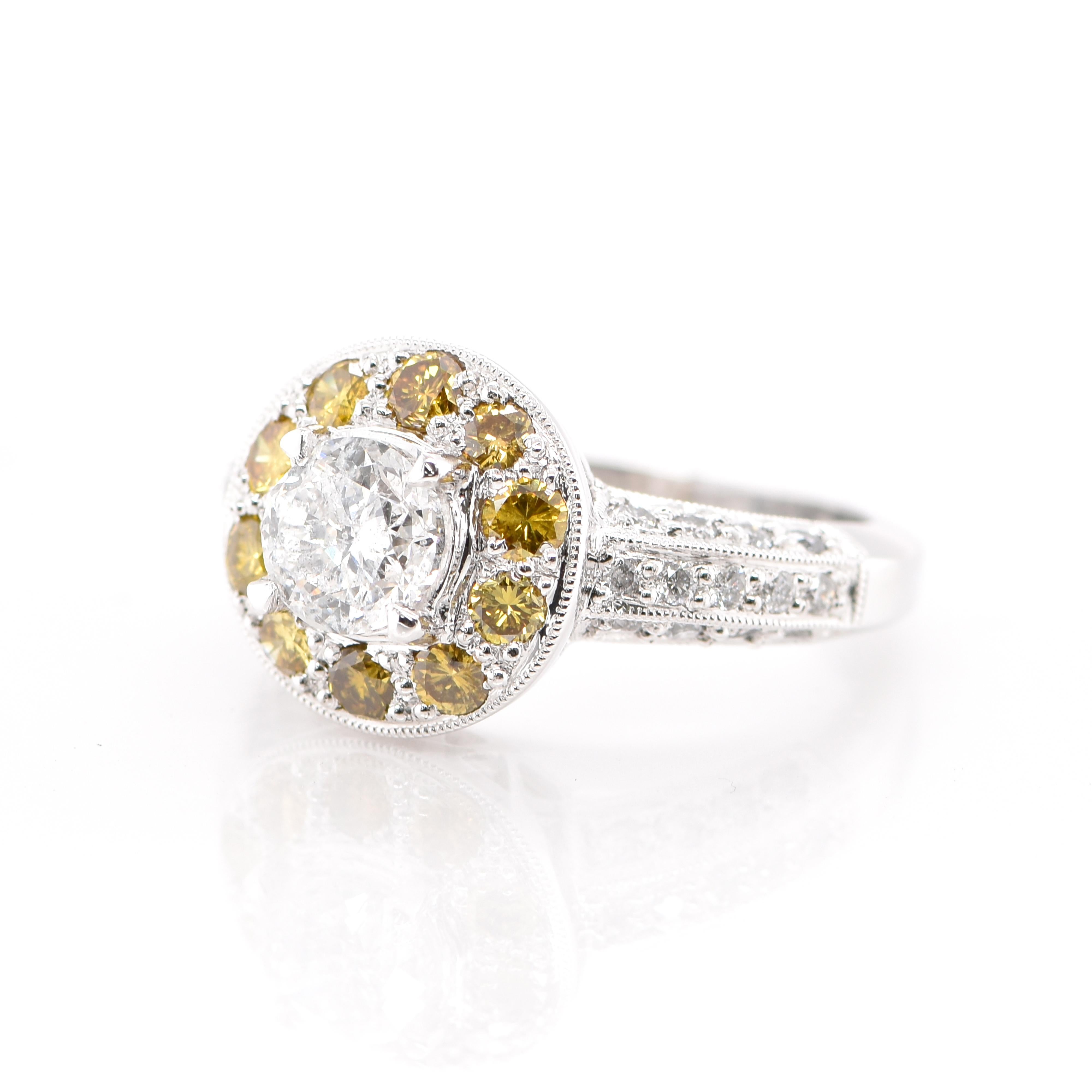 An gorgeous Edwardian Ring featuring a 1.00 Carat Natural F, I-1 Center Diamond surrounded by 0.45 Carats of Yellow Diamond and 0.66 Carats of White Diamonds set in Platinum. Diamonds have been adorned and cherished throughout human history and date