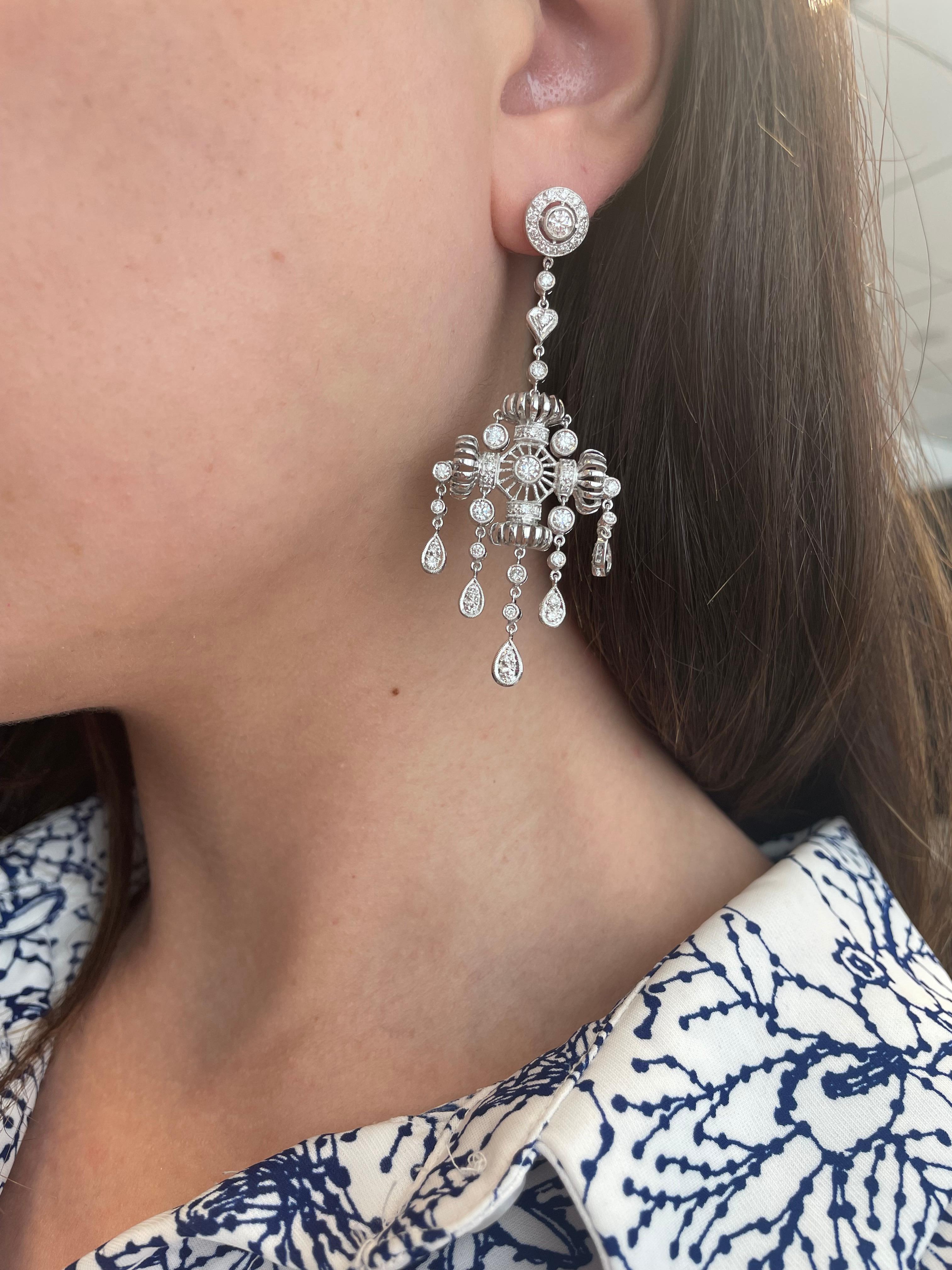 Lovely Edwardian inspired diamond chandelier earrings.
104 round brilliant diamonds, 2.88 carats. Approximately G/H color and SI clarity. 18-karat white gold.
Accommodated with an up to date appraisal by a GIA G.G. upon request. Please contact us