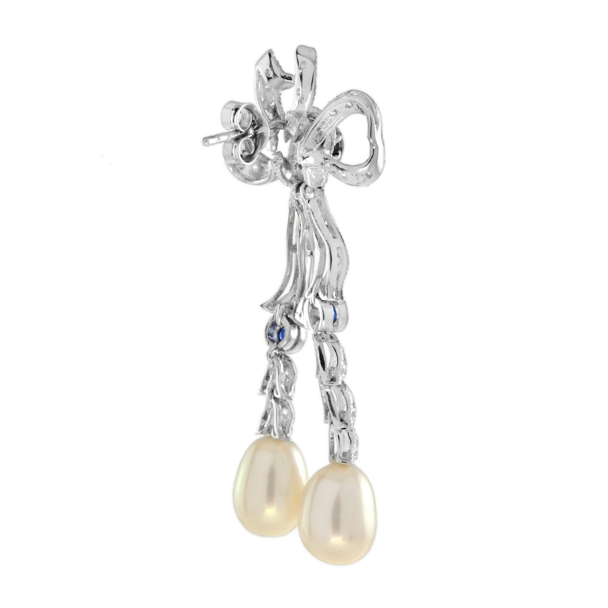 Ohrgehänge im edwardianischen Stil mit Schleife, Diamant und Saphir mit Perlen aus 14 Karat Gold (Tropfenschliff) im Angebot