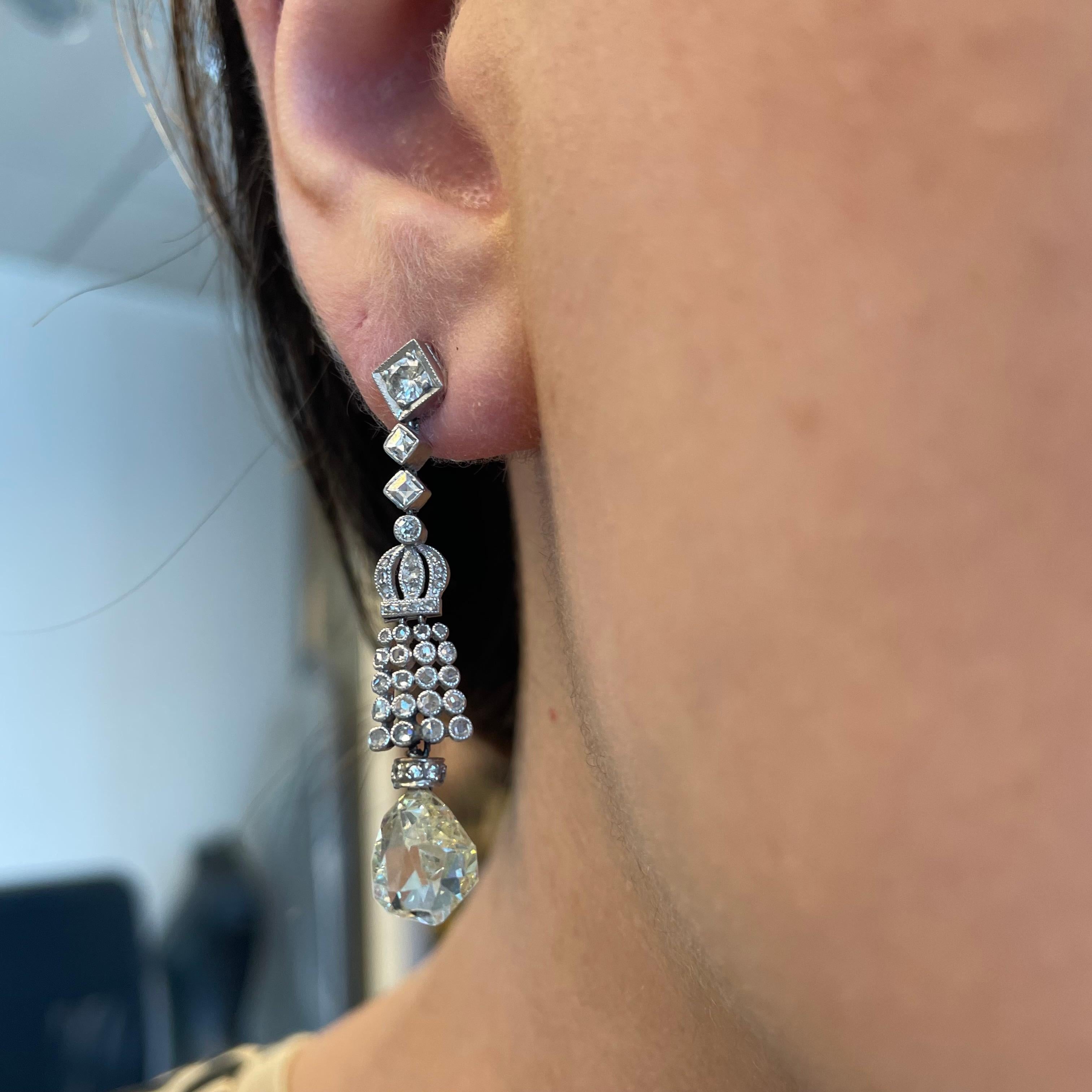Edwardian inspired crown motif diamond earrings.
Center briollete diamonds complimented with round brilliant diamonds, 18k white gold. 
Accommodated with an up-to-date appraisal by a GIA G.G. once purchased, upon request. Please contact us with any