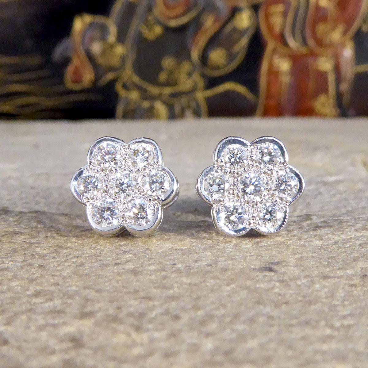A lovely piece that will stand the test of time, these beautiful Diamond cluster earrings resemble a Daisy floral shape with a Diamond in the centre surrounded by 6 equally sized Diamonds. Together both earrings hold a total of 1.05ct Diamonds