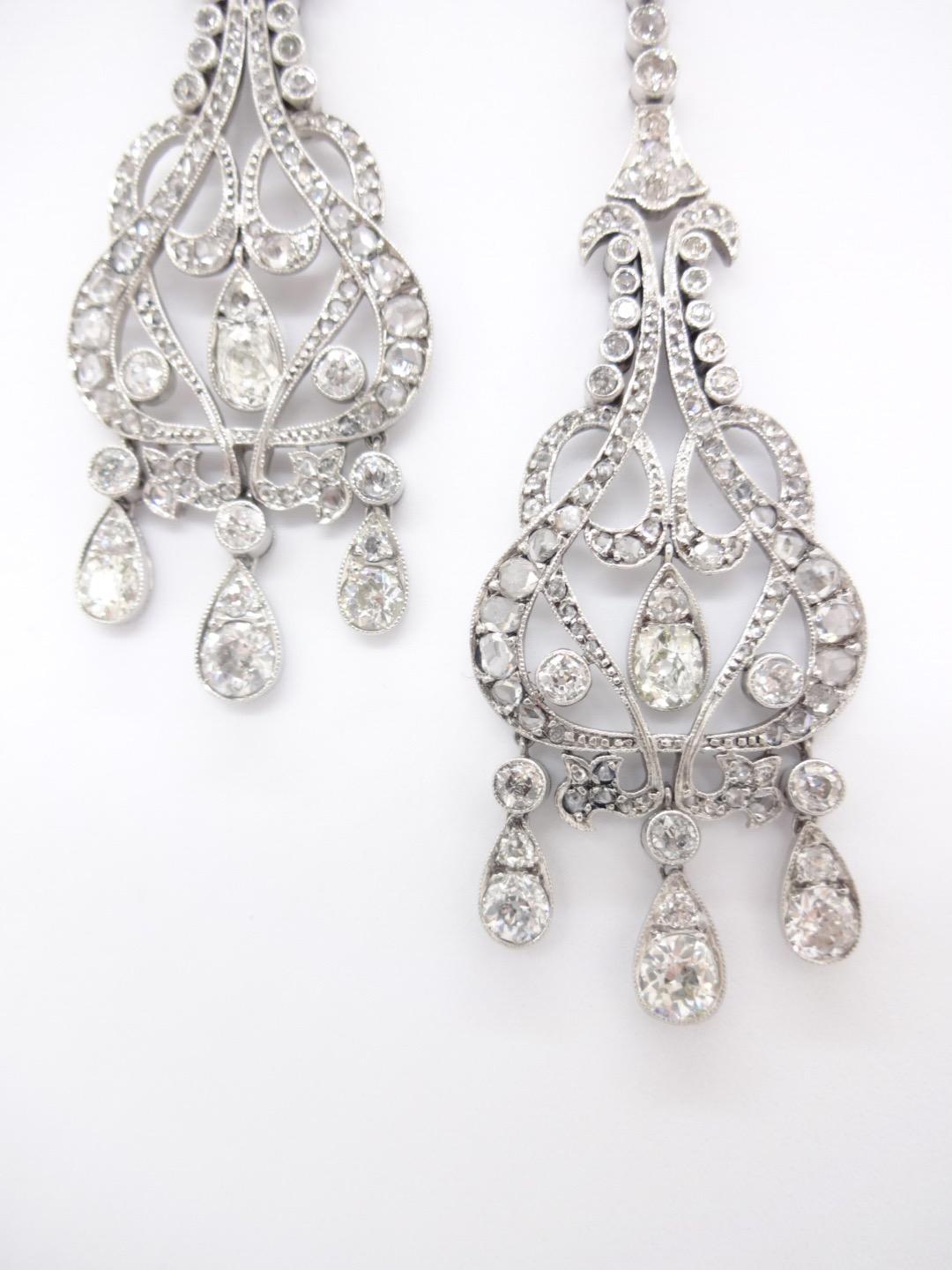 With a dramatic shapely silhouette, these chandelier earrings harken back to a bygone era.  Beautifully crafted in platinum with 8.50 carats of beautiful bright white diamonds, you'll find a million things to wear this with from leather bomber