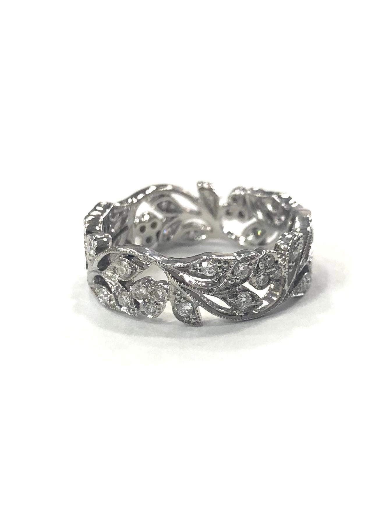 18ct White Gold Diamond Set Floral Design Band Ring. Edwardian Style.
Set with round brilliant cut diamonds in a Milgrain setting.

Approximate total diamond weight : 1.60ct

Width : 6mm
Ring Size : O
Total Weight : 5.3g