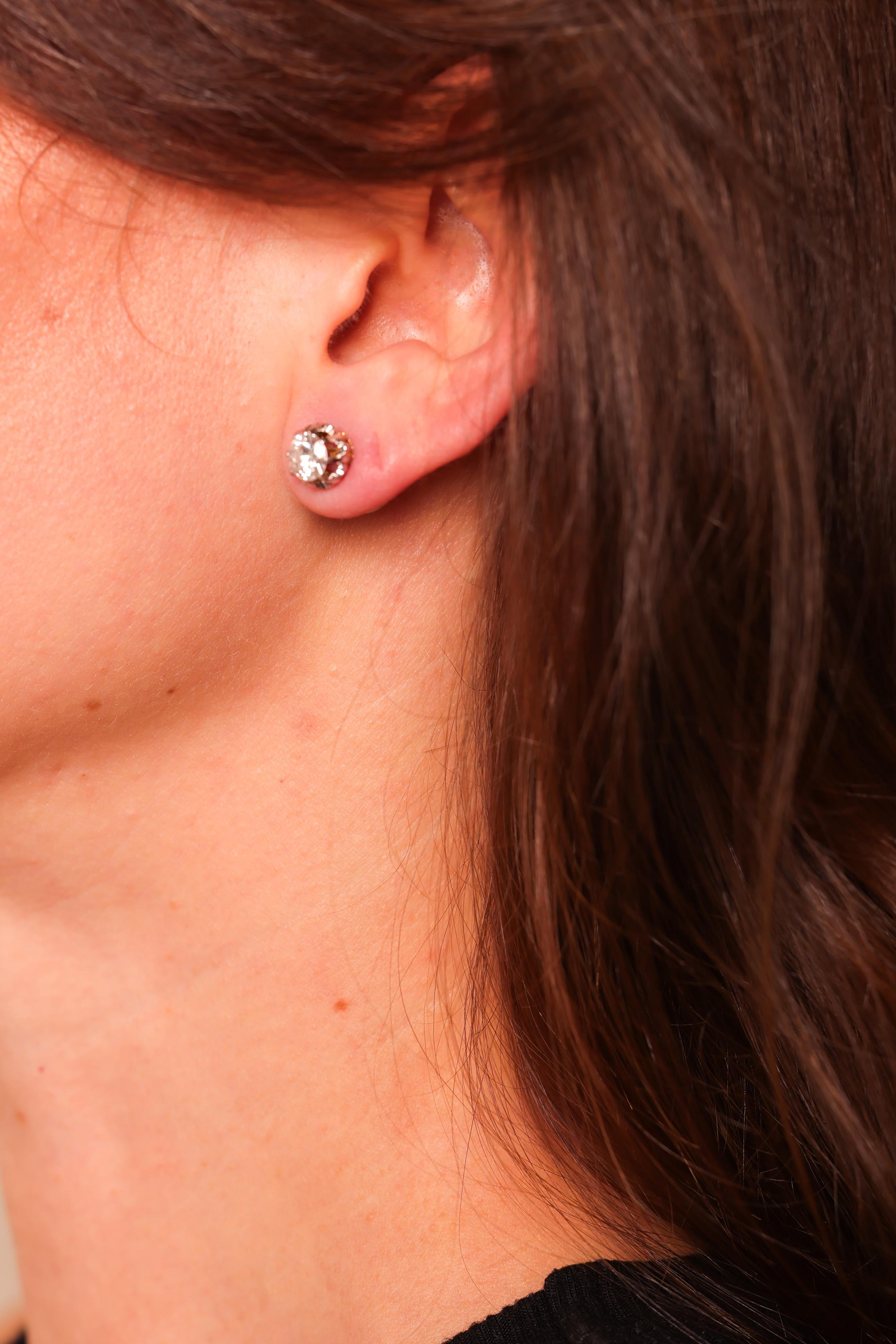 Center Stone: 2 Diamonds
Cut: Round Brilliant
Weight: Approximately 1.40 Carats
Color: I
Clarity: SI
Metal: 18K Yellow Gold and Platinum
Era: Modern
Circa: 2020s in The Style of Edwardian
Hallmarks: 18K, Pt Purity Marks
Size: 8mm diameter
Gram