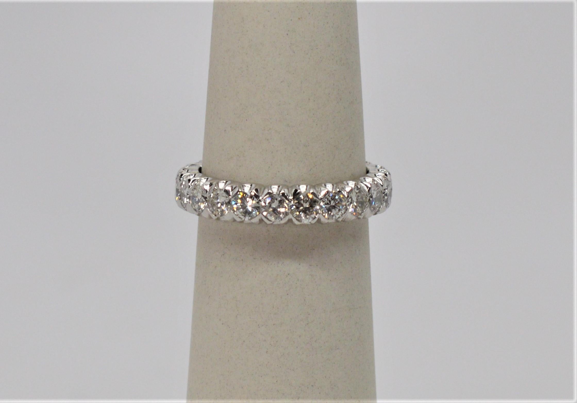 Edwardian Style Platinum and Diamond Eternity Band Ring in size 6-3/4. Crafted with twenty-three round .10 carat fine white diamonds, 2.3 carats total weight.  .900 Platinum. In Gift box.
 