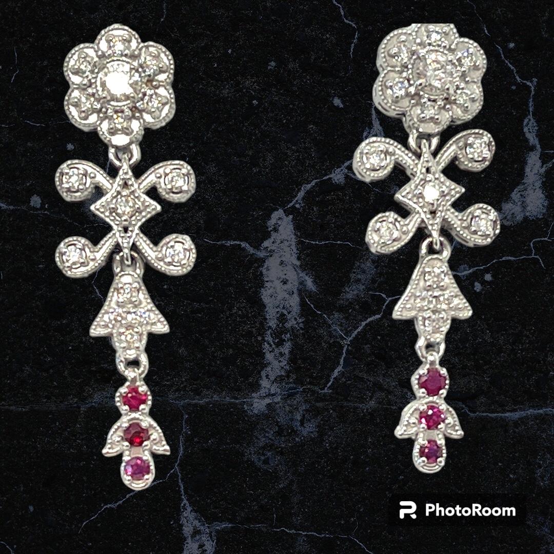 These earrings are truly fit for Royalty! 

The design is fashioned on earrings from the Edwardian period when flower clusters and delicate design reigned in aristocratic circles. They are crafted in 18ct White Gold and are set with natural Diamonds