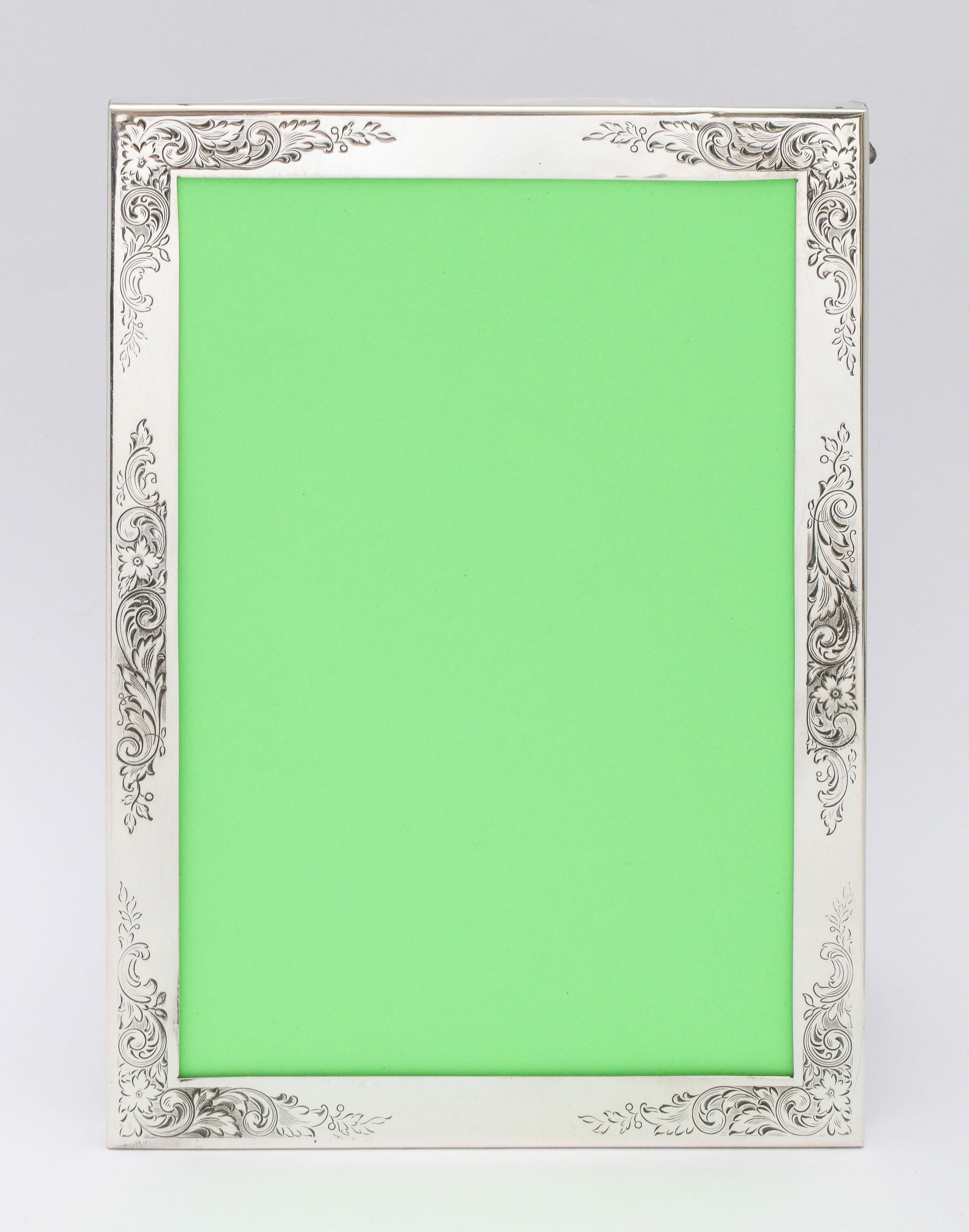 Edwardian-style, sterling silver picture frame with wood back, Gorham Manufacturing Co., Providence, Rhode Island, Ca. 1940's. Frame will stand both horizontally and vertically. Outside measurements of frame are 7 3/4 inches high x 5 1/2 inches wide
