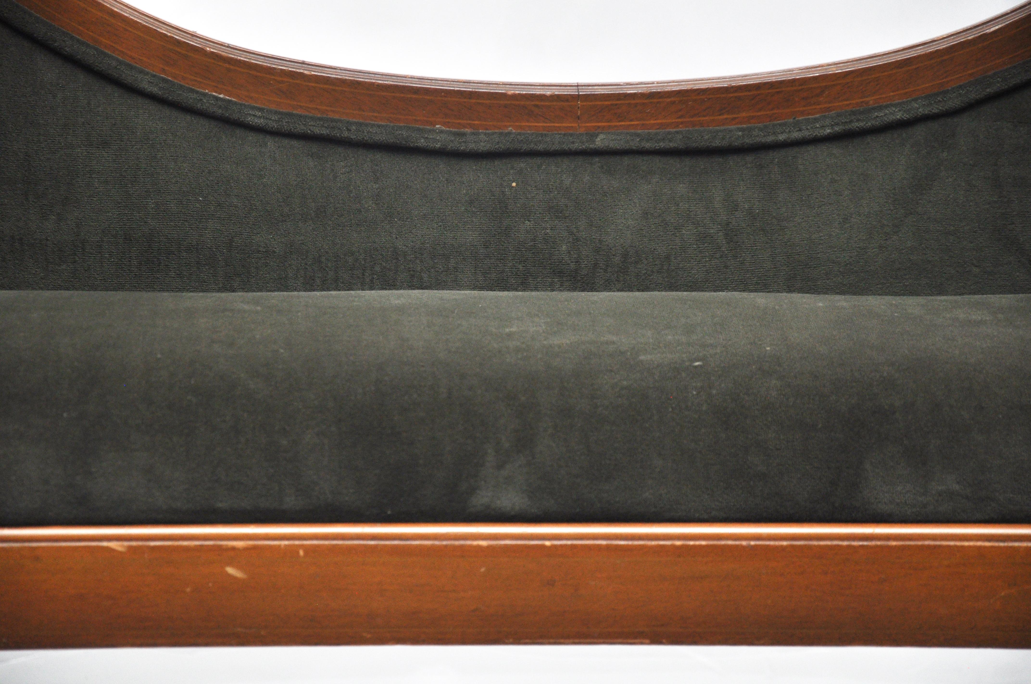 Exceptional lines of this Edwardian / Art Nouveau style upholstered bench. The bench is in need of reupholstering. There is a mark on the right side if you zoom in on the 4th image.