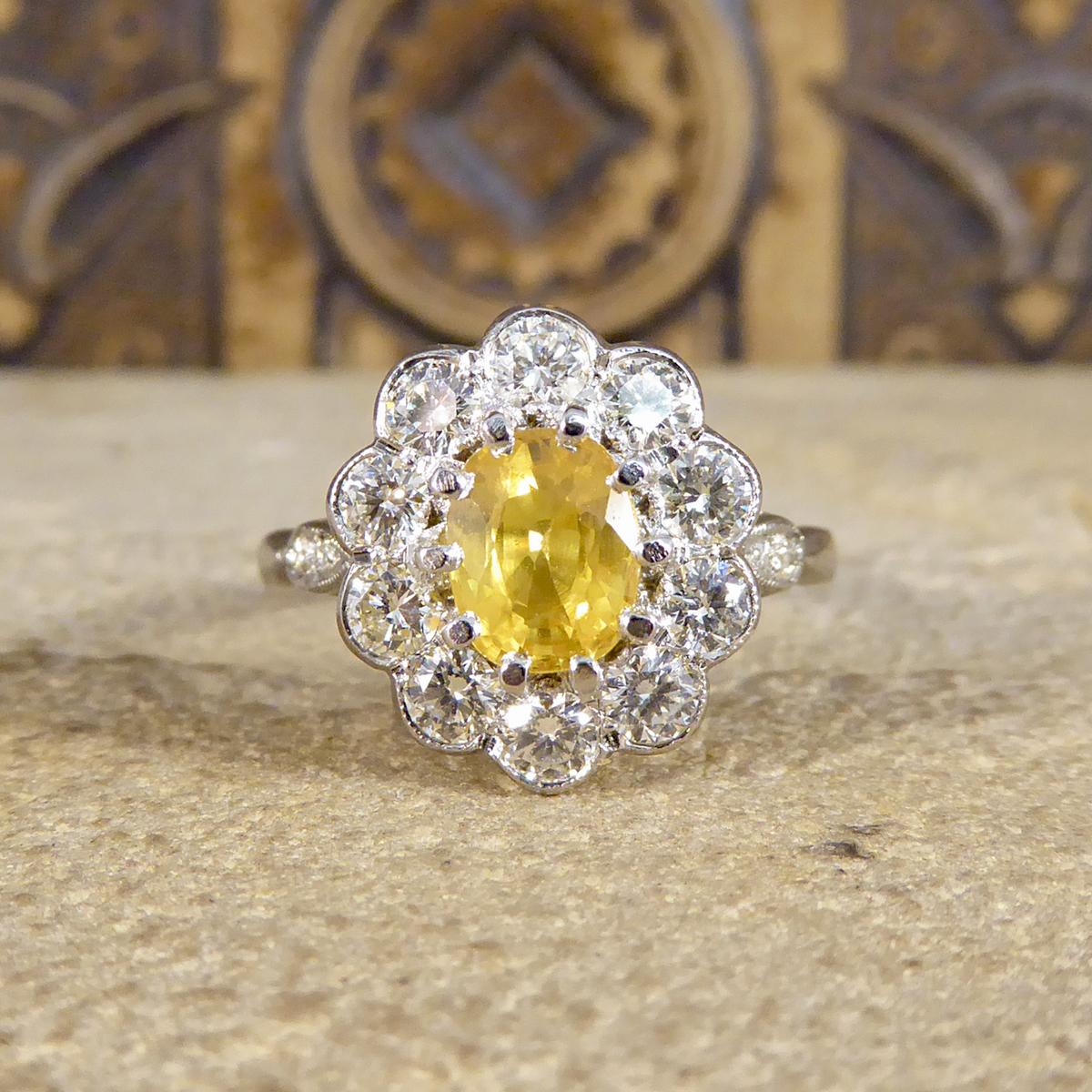 This contemporary Ring has been crafted to resemble an Edwardian style ring. A 1.40ct bright and beautiful Yellow Sapphire in a claw setting in the centre of the ring and surrounded by a halo of 10 European cut Diamonds. Complimenting the gem stones