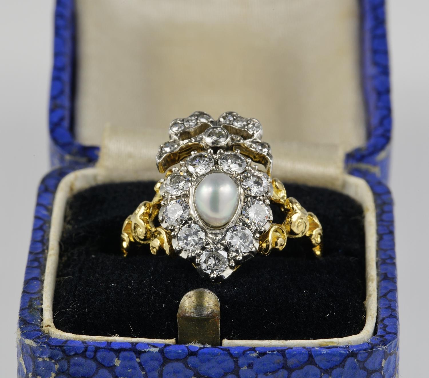 Edwardian Romanticism
This delightful Edwardian period ring is 1910 ca.
Charming Sweet Heart crown adorned with Natural Pearl & Diamonds, topped by a bow, and carving details throughout the mount
Hand crafted of solid 18 KT gold with silver