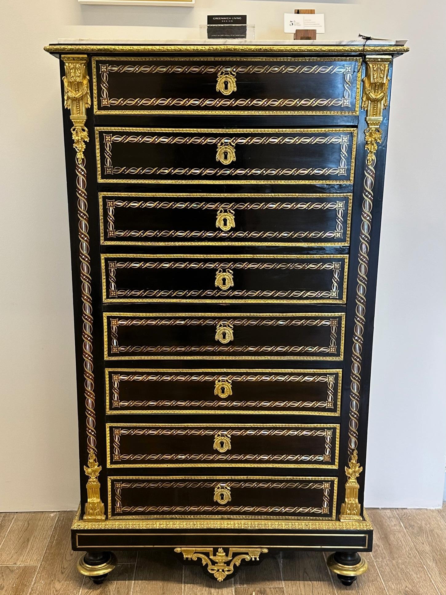 This spectacular Edwardian Bouille inlaid And bronze-mounted Abattant chest desk has been meticulously refinished and hand rubbed French polished to its original form. Having wonderfully chiselled bronze mounts with an overwhelming inlay of