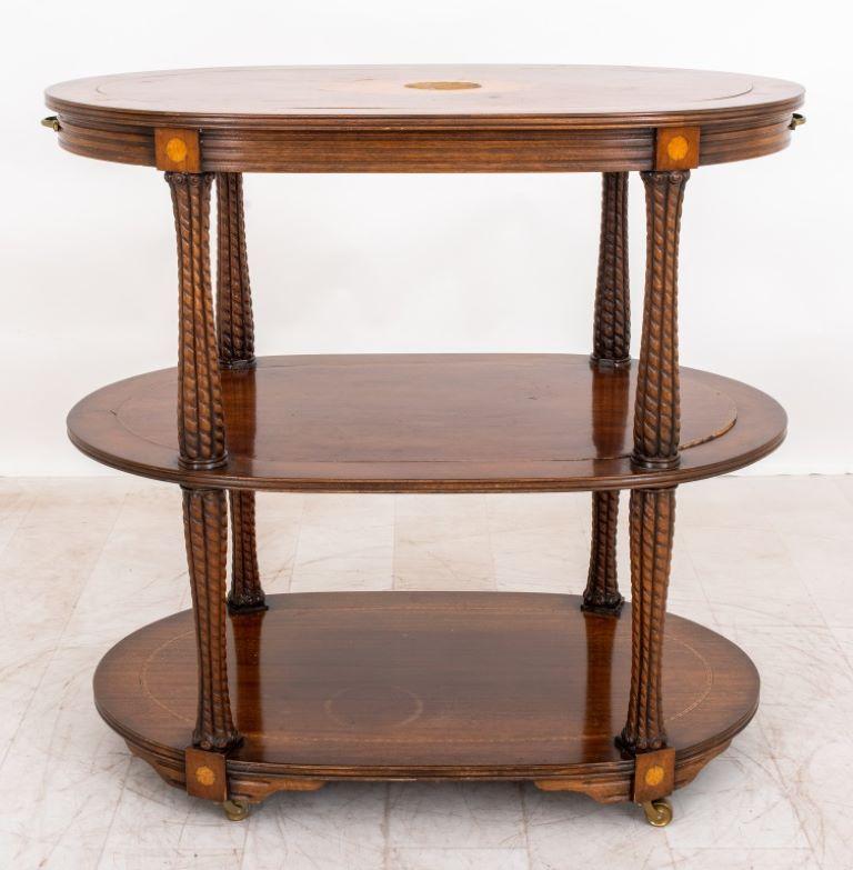 Late Victorian or Early Edwardian Two Tiered Tea or Bar Table, circa 1900, of oval form with inlaid top, and rope twist borders on four legs conjoined by an under tier. Provenance: From a 146 West 57th Street collection.

Dealer: S138XX