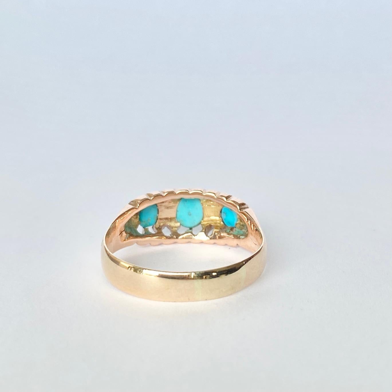 This gorgeous Edwardian three stone holds a trio of bright blue turquoise stones and in between them sit a pair of bright, round sparkling diamond points. Fully hallmarked Birmingham 1886.

Ring Size: R 1/2 or 8 3/4 
Width: 8mm

Weight: 3.1g