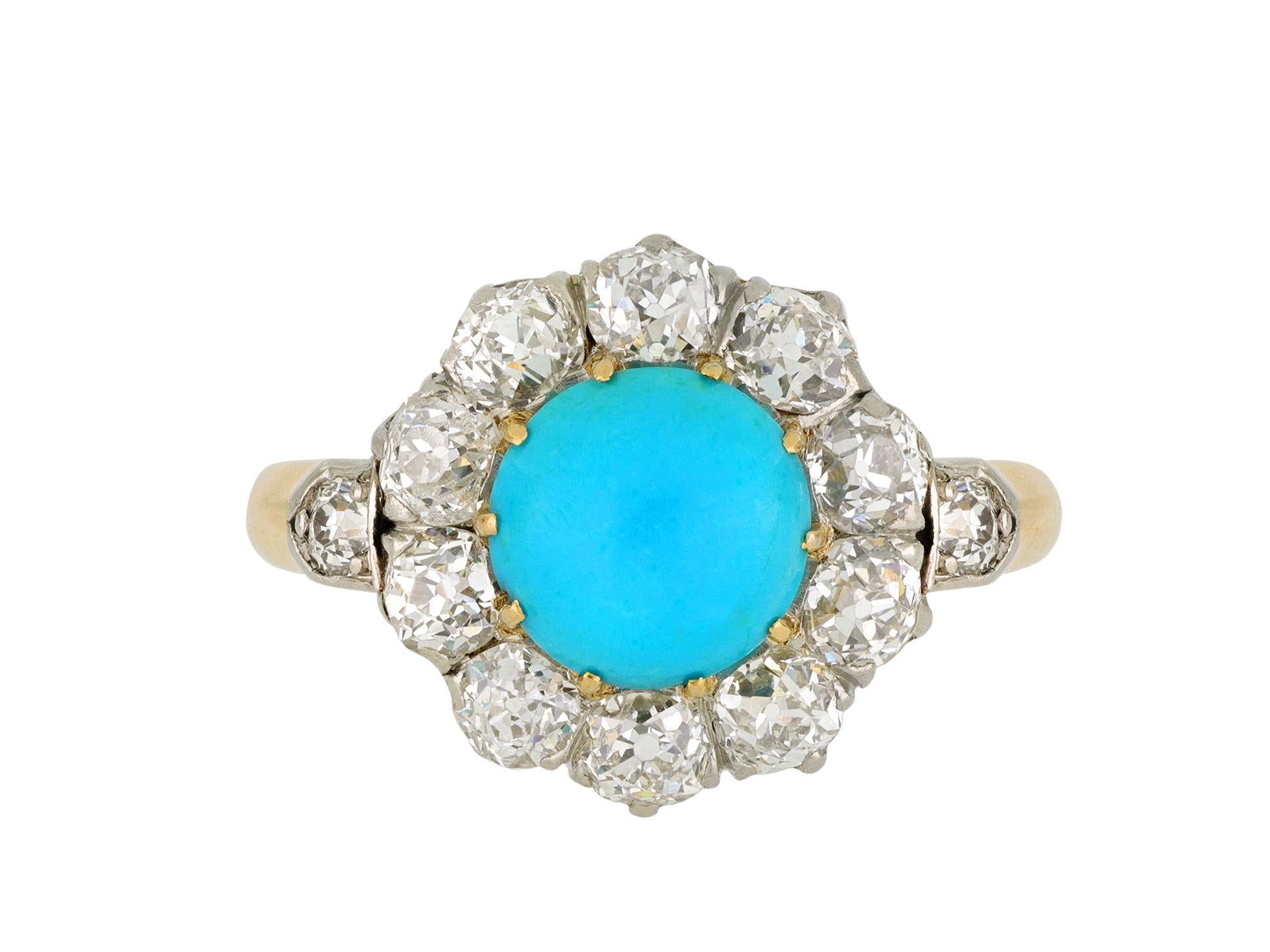 Edwardian turquoise and diamond coronet cluster ring. Set to center with a round cabochon cut natural turquoise in an open back claw setting, with an approximate weight of 1.20 carats, encircled by ten cushion shape old mine diamonds in open back