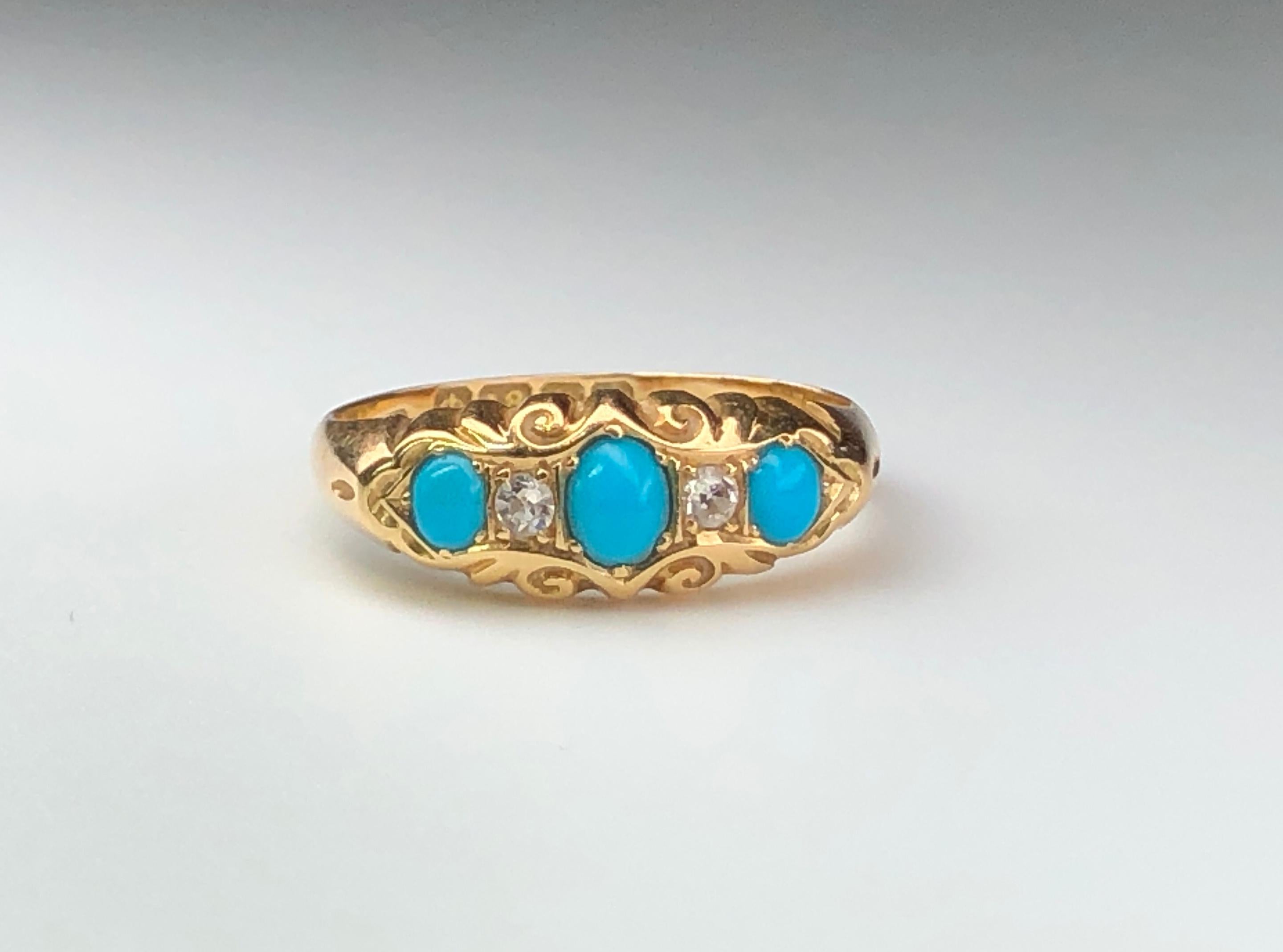 This striking antique turquoise and diamond ring features three cabochon turquoise and two diamonds to the head, setting in 18K Gold.

This ring is an antique example dated to Birmingham 1915.

Turquoise is the birthstone for December and is thought