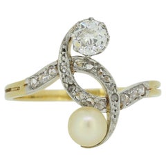 Edwardianischer Crossover-Ring mit zwei Steinen, Perlen und Diamanten