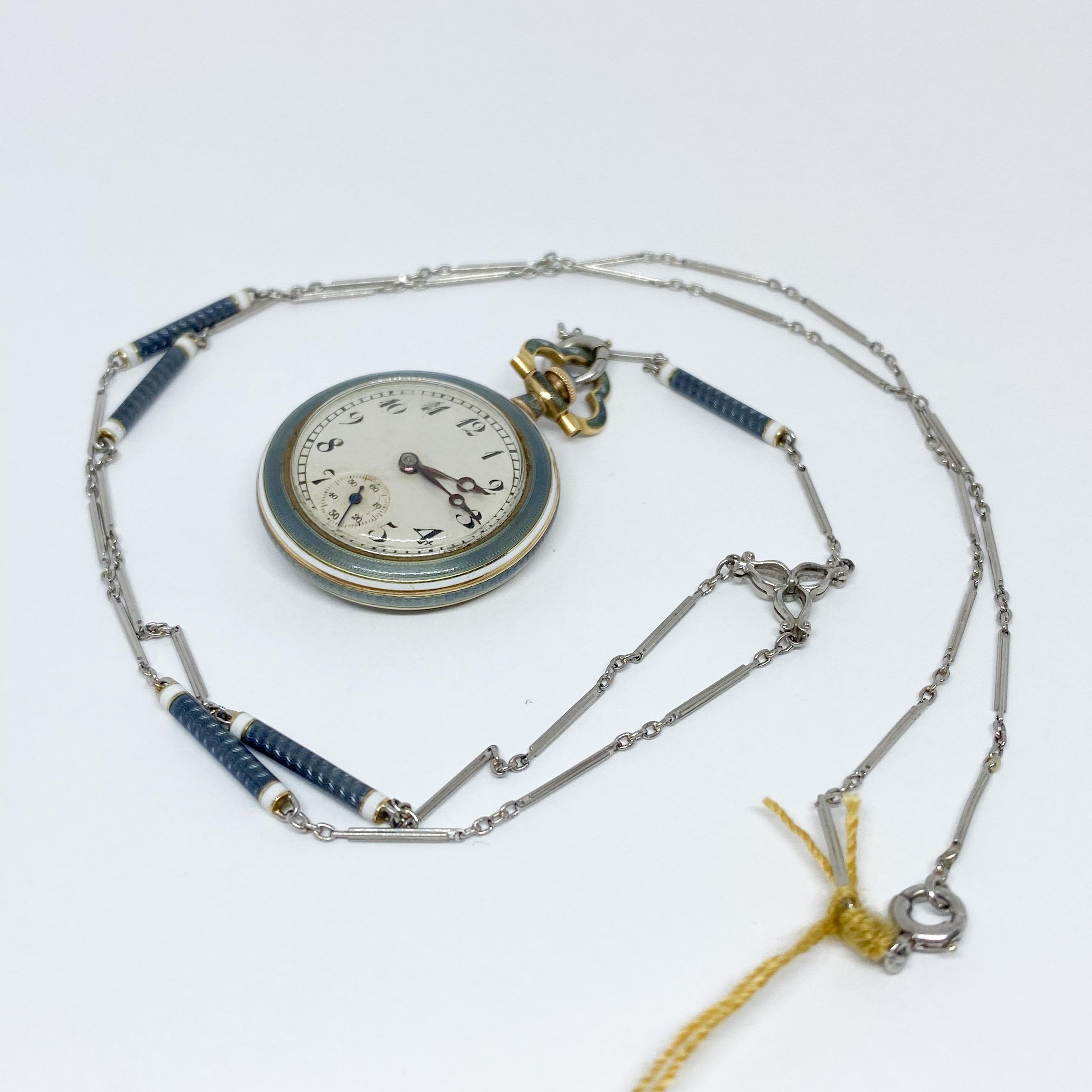 Edwardian vintage watch pendant in original condition! Designed in 14K yellow gold and Platinum with blue enamel. The necklace with chain and watch measures 21