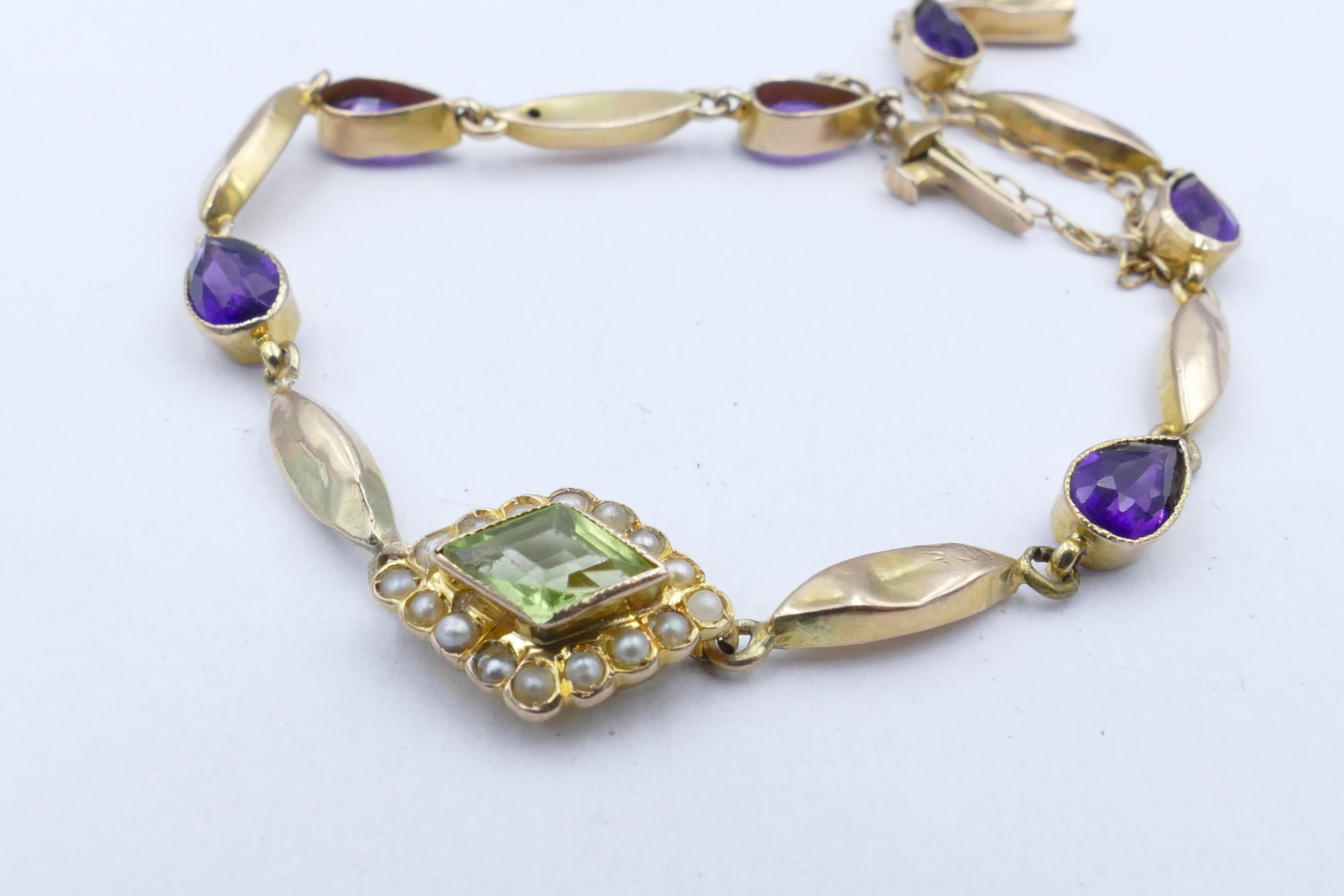 This is such a sweet Bracelet depicting the colours - Purple, White & Green - of the Edwardian Suffragette Movement.
It features 6 Pear cut Amethysts of a deep violet colour. ! X kite cut lightish Peridot as the Centrepiece along with 16 Seed