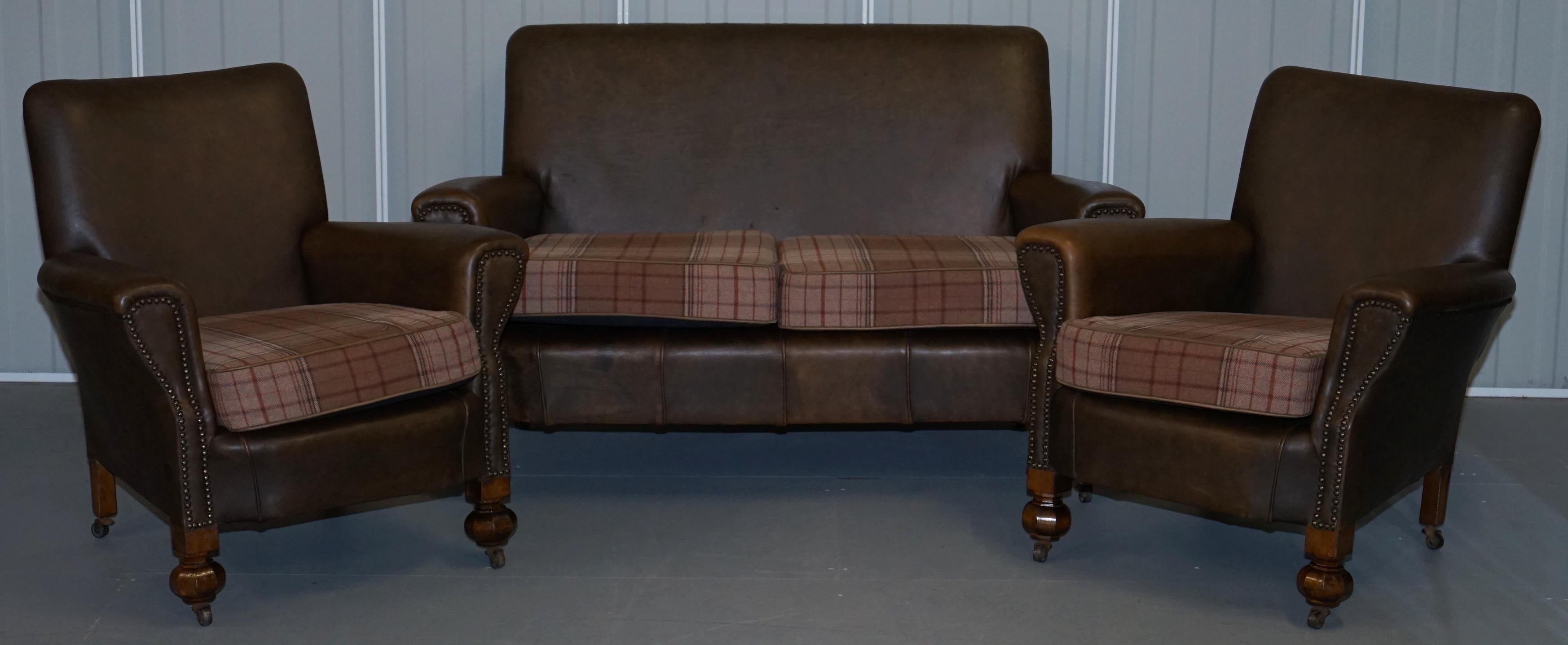 We are delighted to offer for sale this stunning walnut framed Edwardian brown leather three-piece suite with Scottish tartan wool cushions

A very good looking and well-made suite, the frames are all solid walnut, each piece has period Industrial