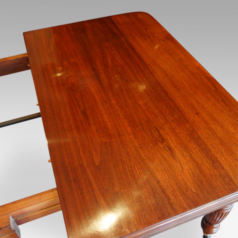 Edwardian walnut extending dining table, by Hampton & sons
This Edwardian walnut extending dining table would have been displayed and sold in Hampton & sons store in Pall Mall.
This solid walnut extending dining table can be used closed without